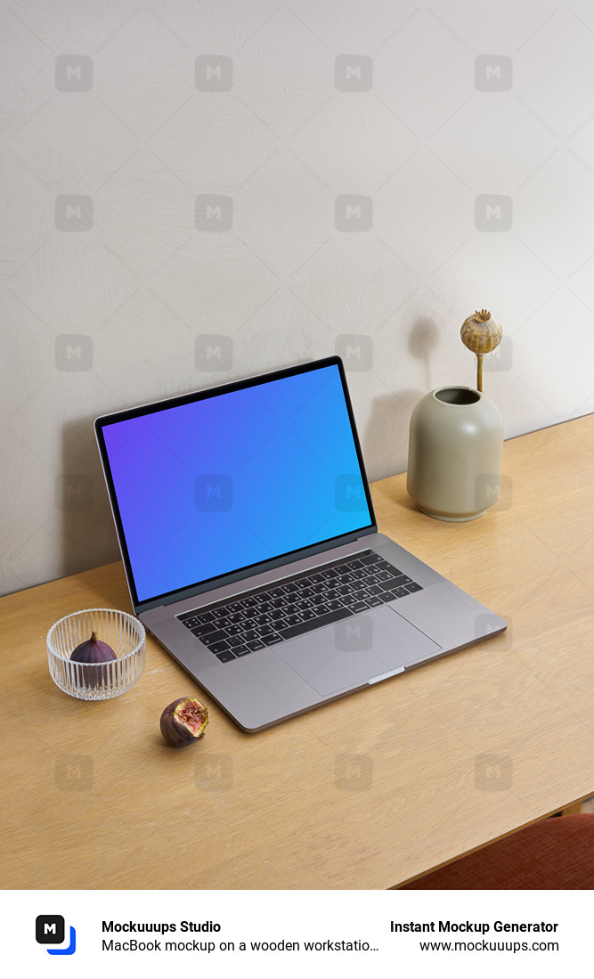 MacBook mockup on a wooden workstation table