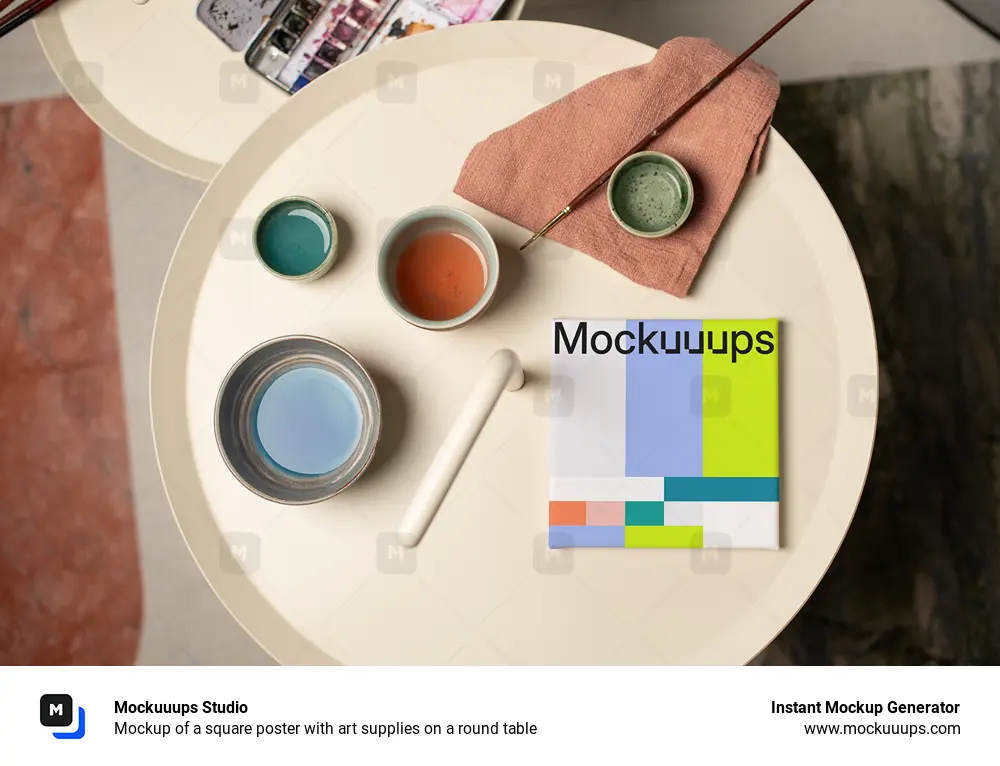 Mockup of a square poster with art supplies on a round table