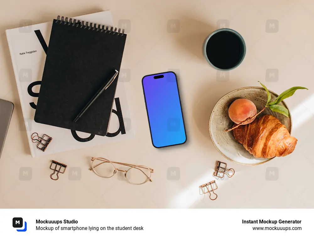 Mockup of smartphone lying on the student desk