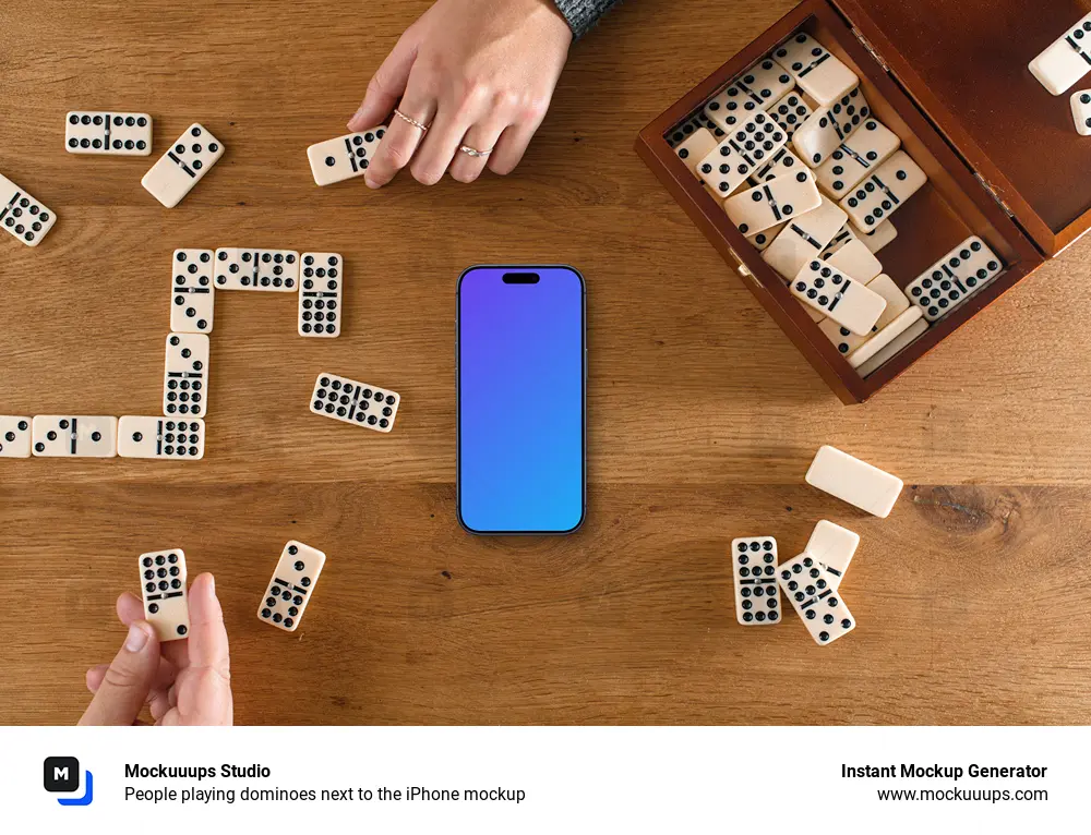 People playing dominoes next to the iPhone mockup