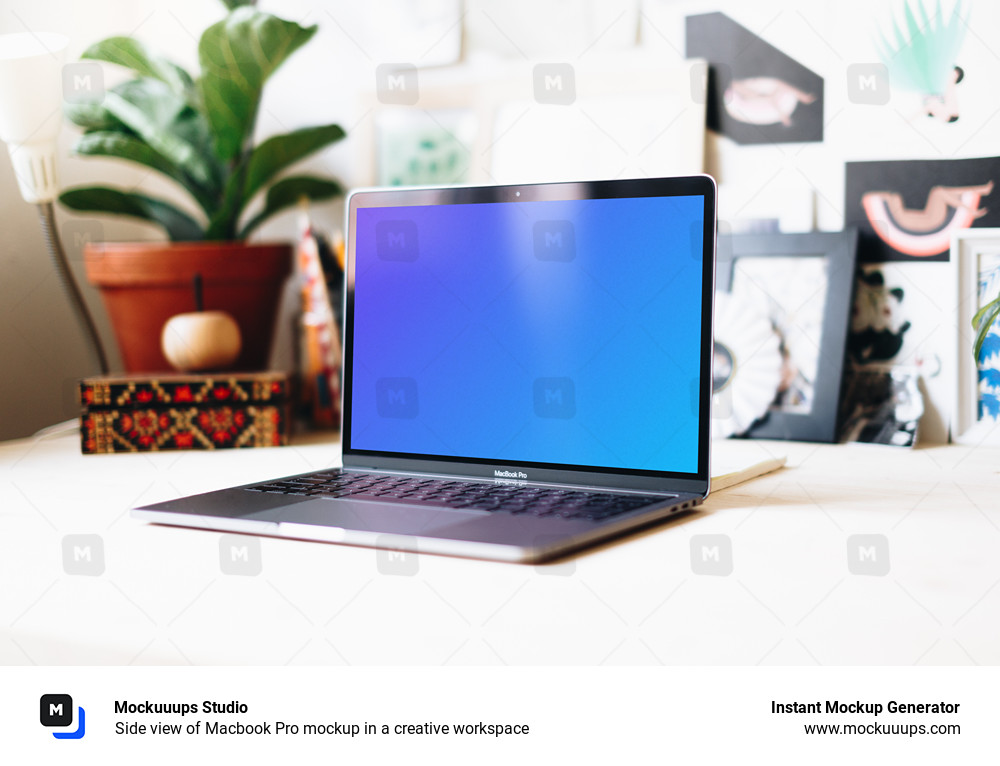 Side view of Macbook Pro mockup in a creative workspace
