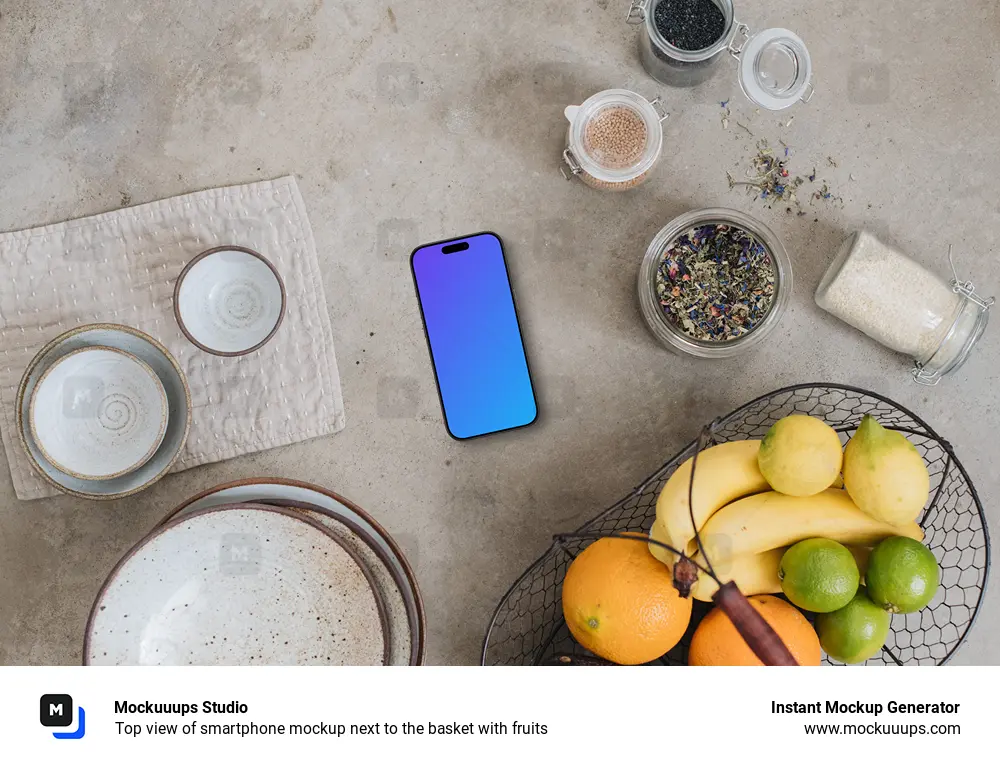 Top view of smartphone mockup next to the basket with fruits