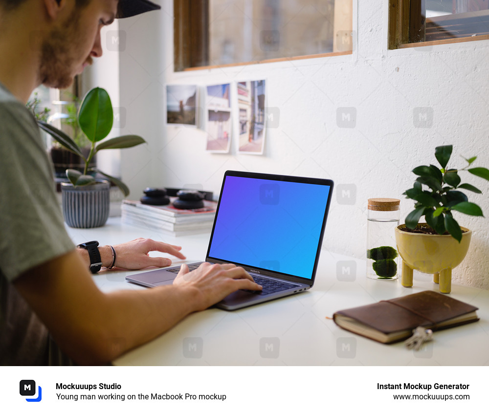 Young man working on the Macbook Pro mockup