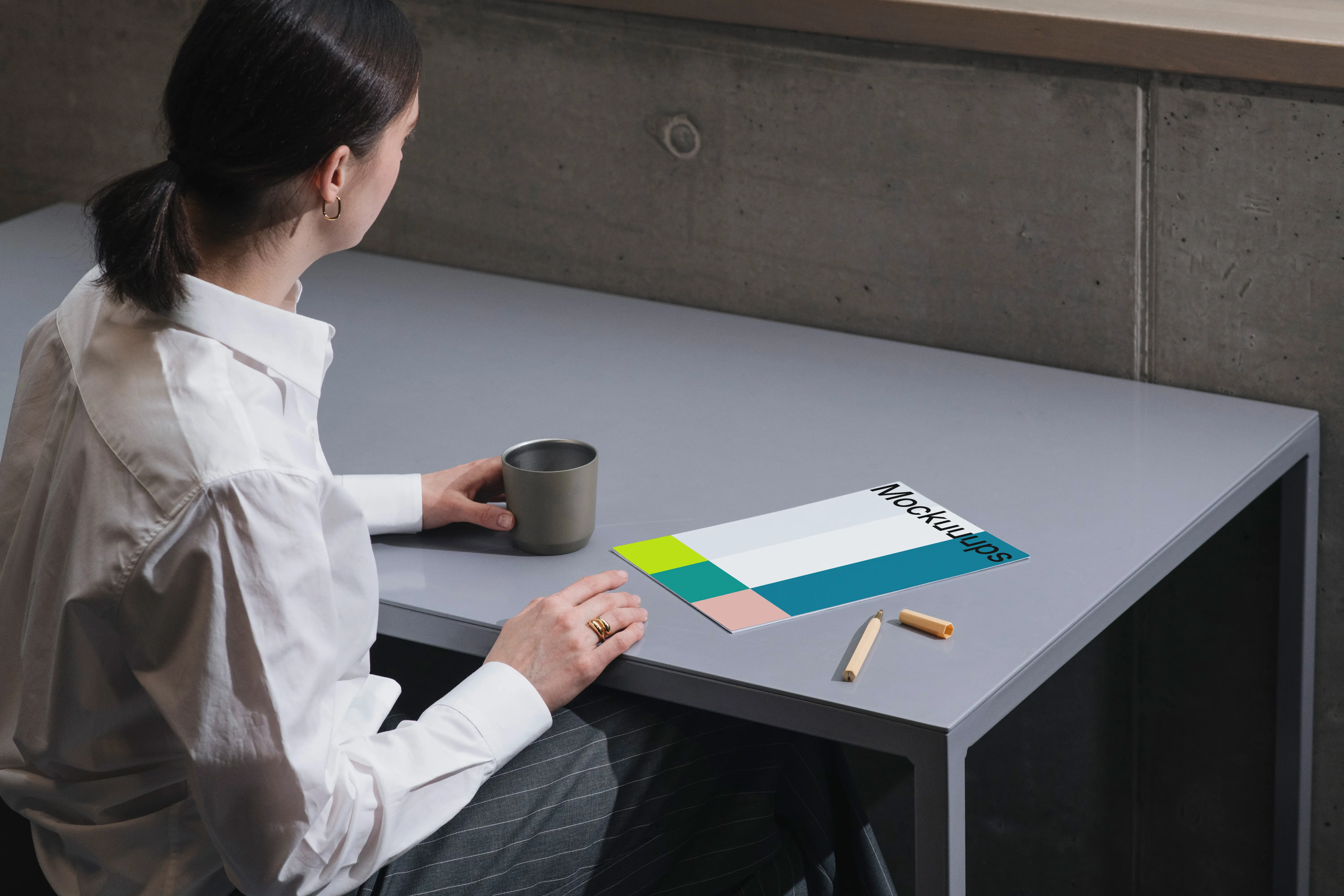 A4 mockup on a gray desk with office elements