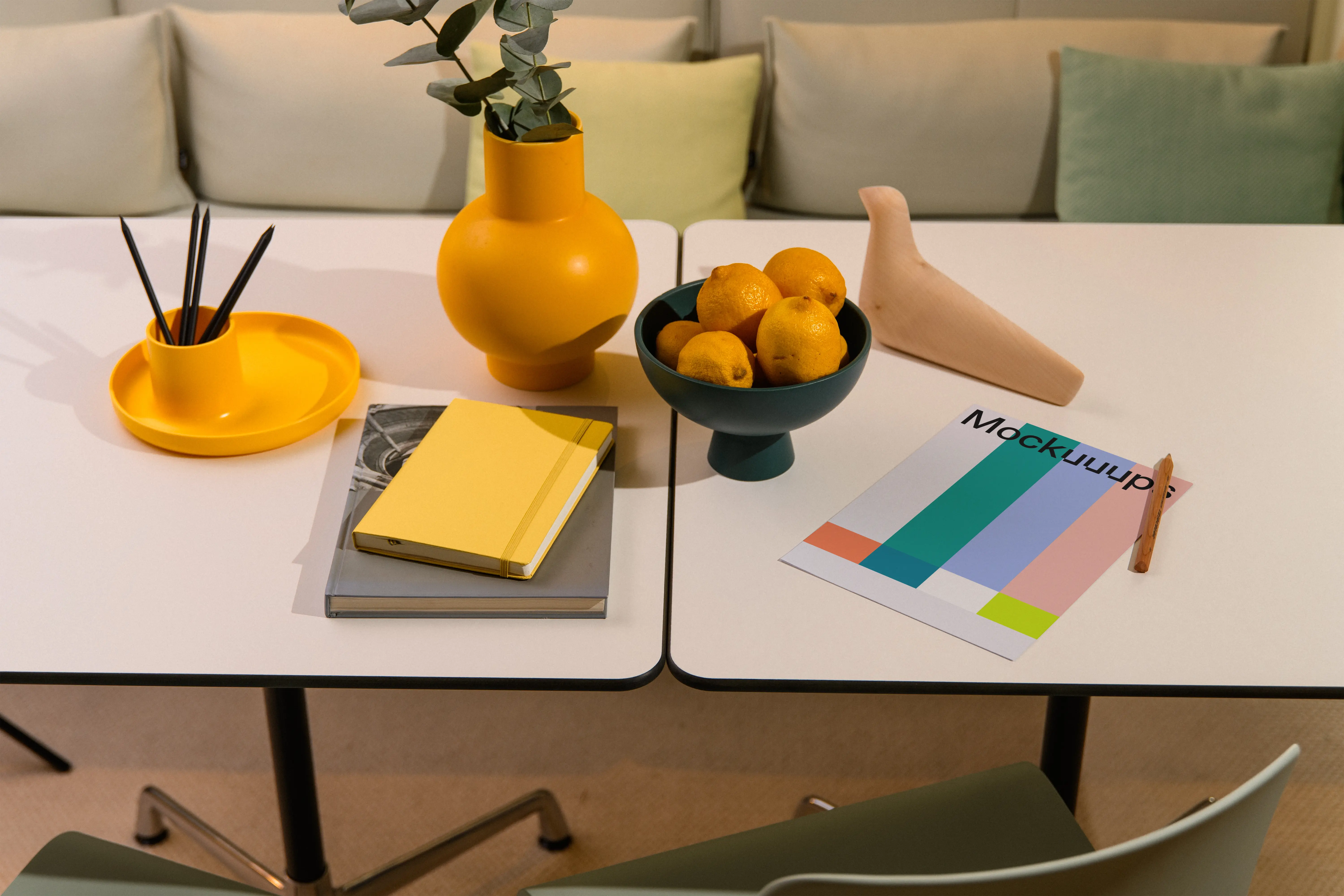 A4 mockup on a modern table with colorful decorations