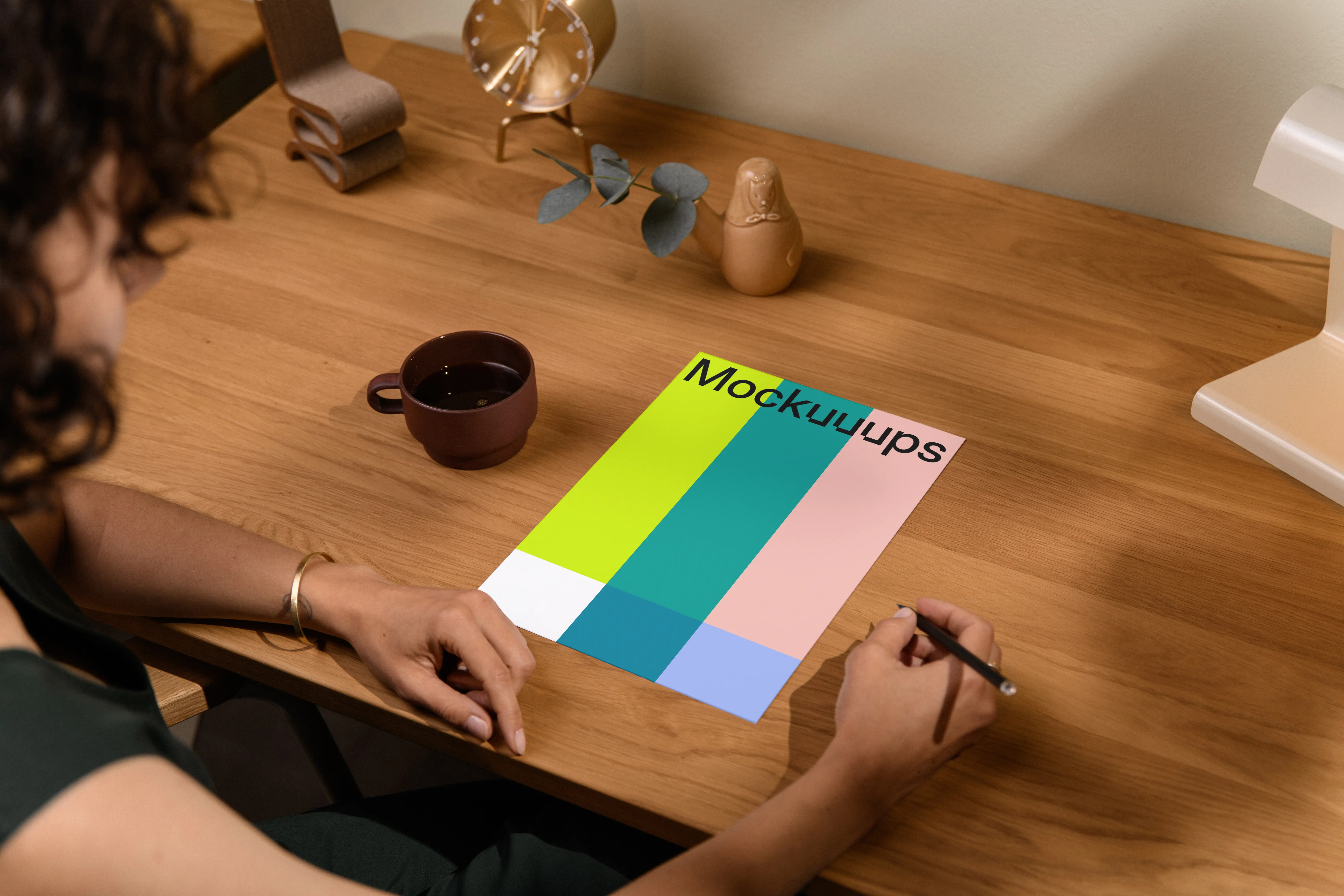 A4 mockup on a wooden desk with decor items