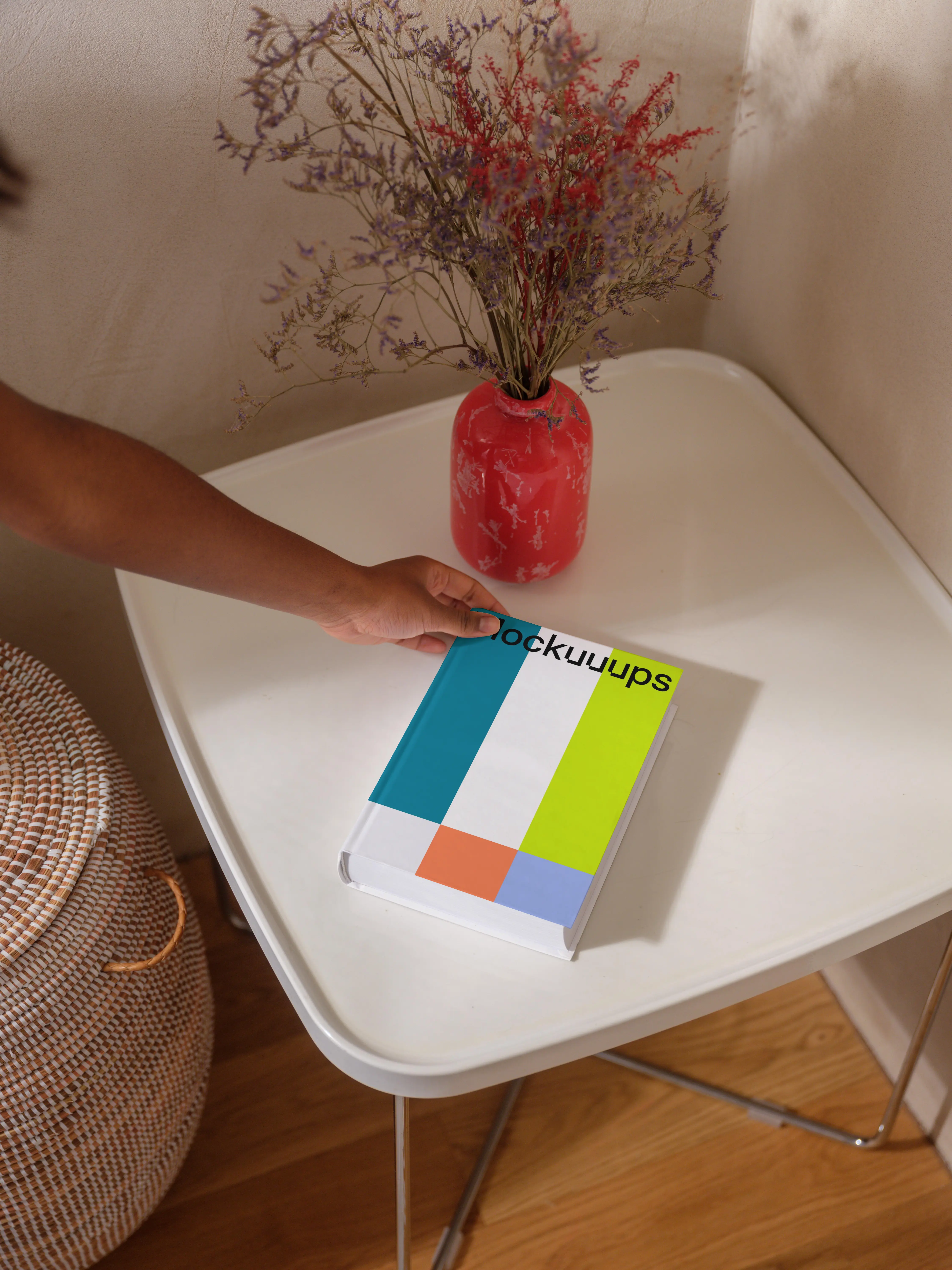 B-format book mockup on a modern white table