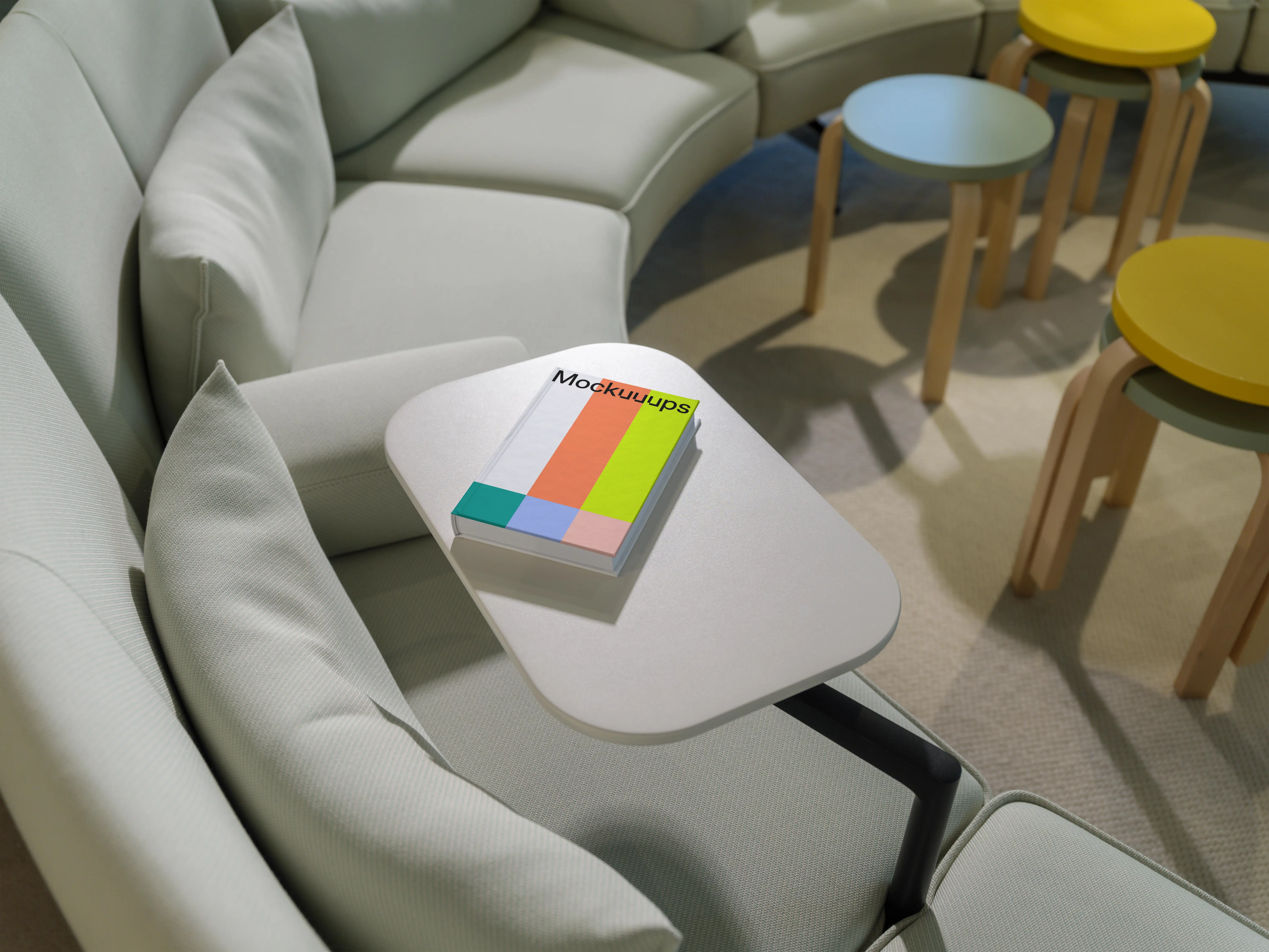 C-format book mockup on a modern lounge table