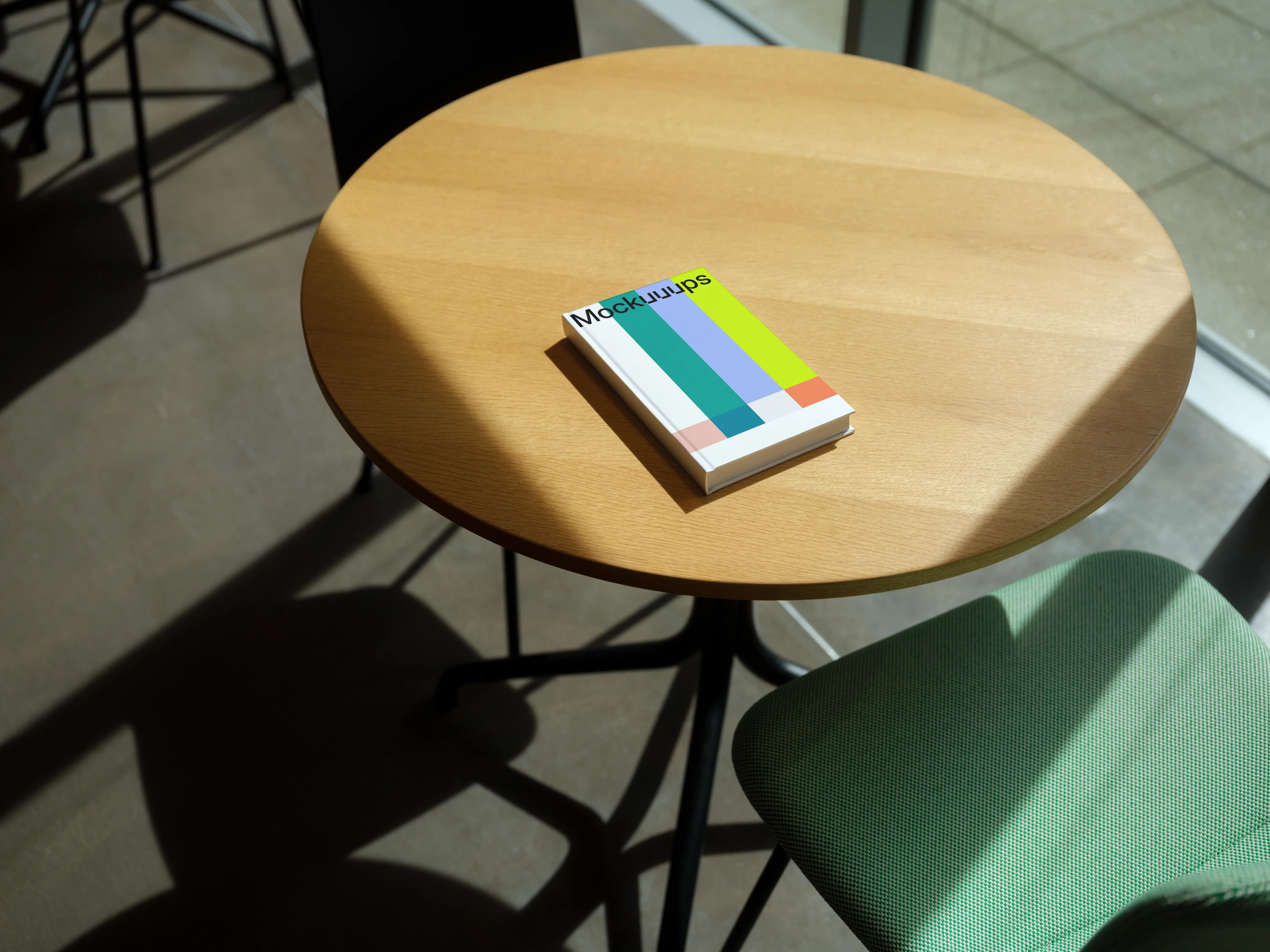 C-format book mockup on a wooden round table