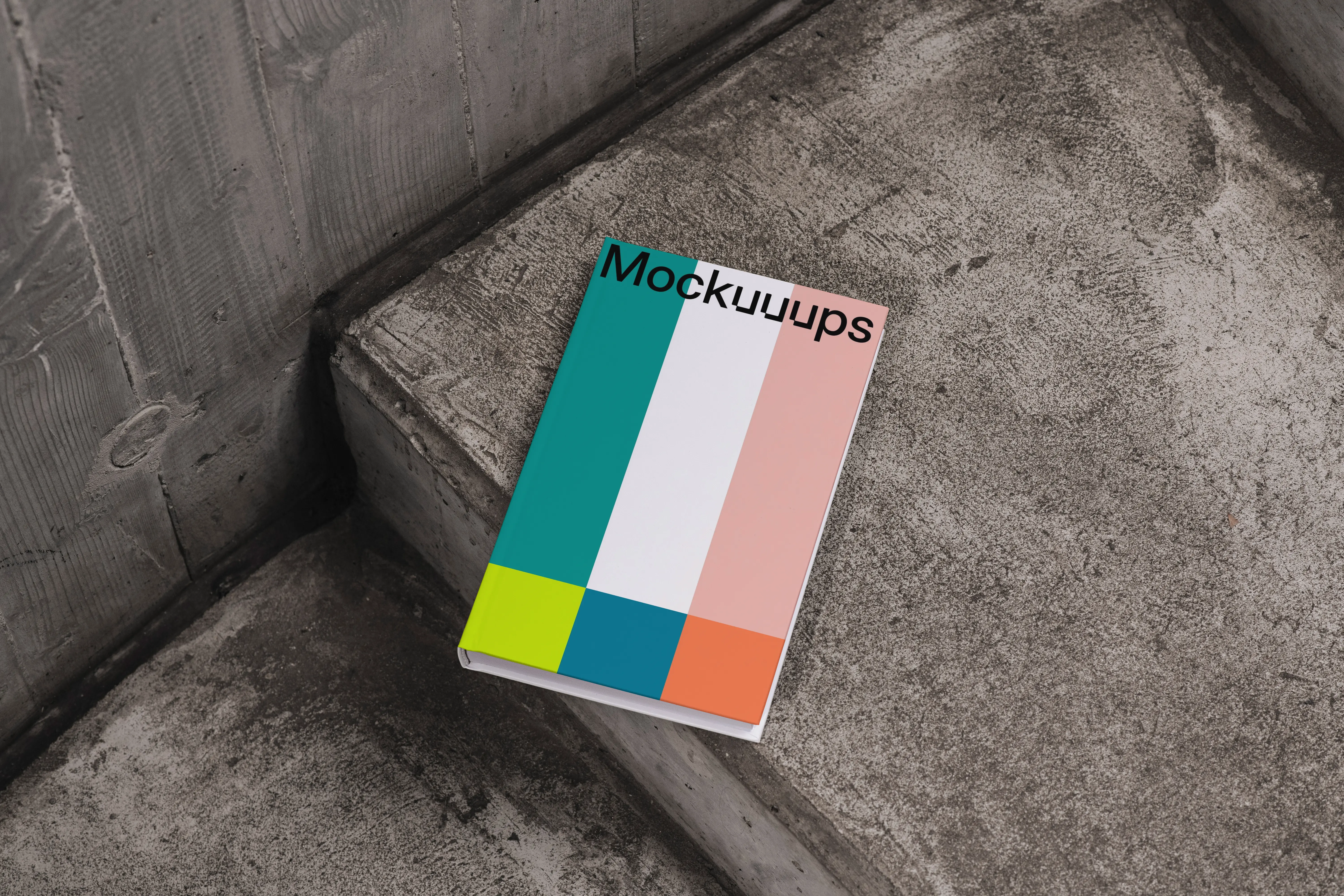 C-format book mockup on concrete stairs