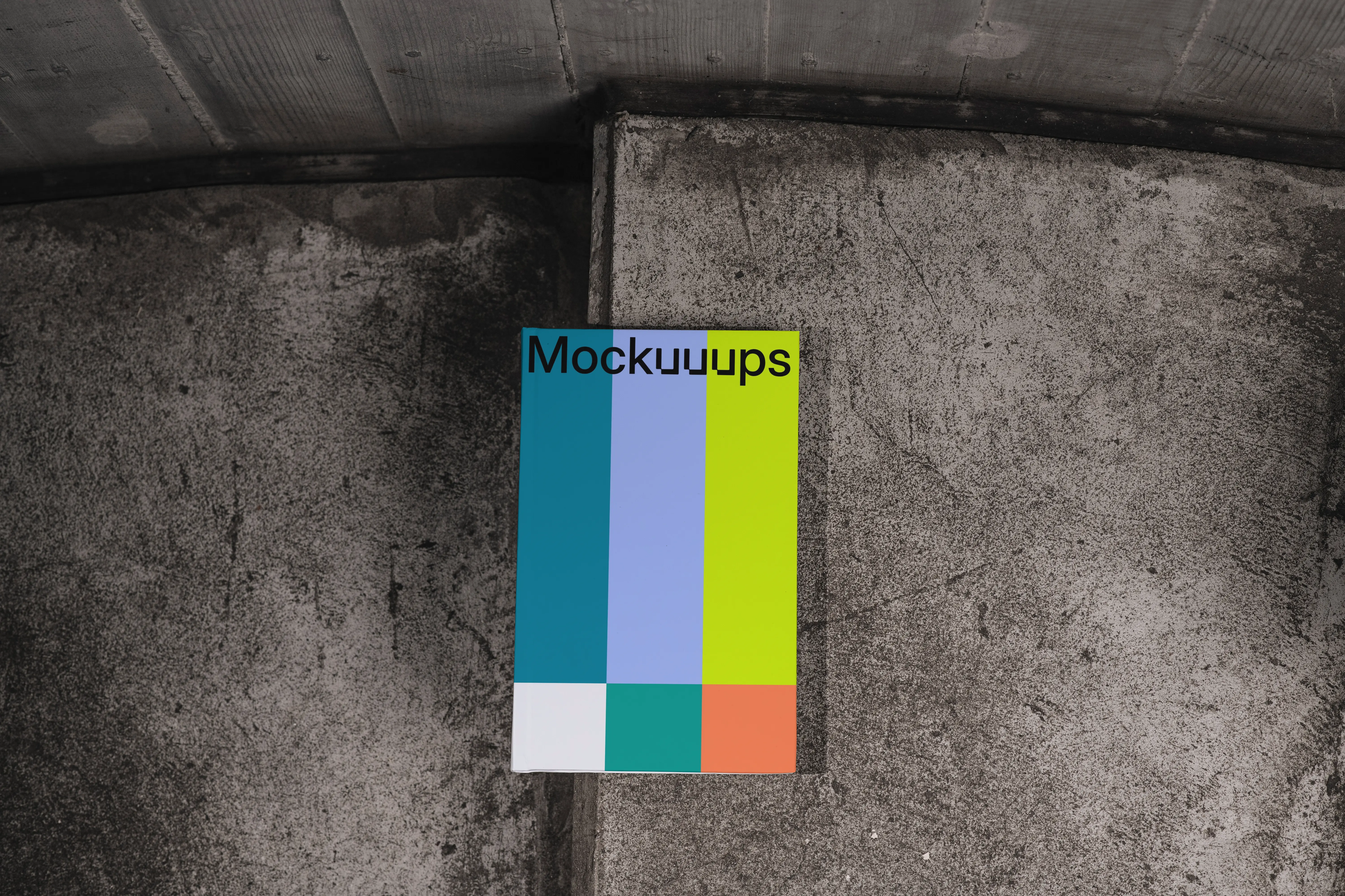 C-format book mockup on textured concrete background