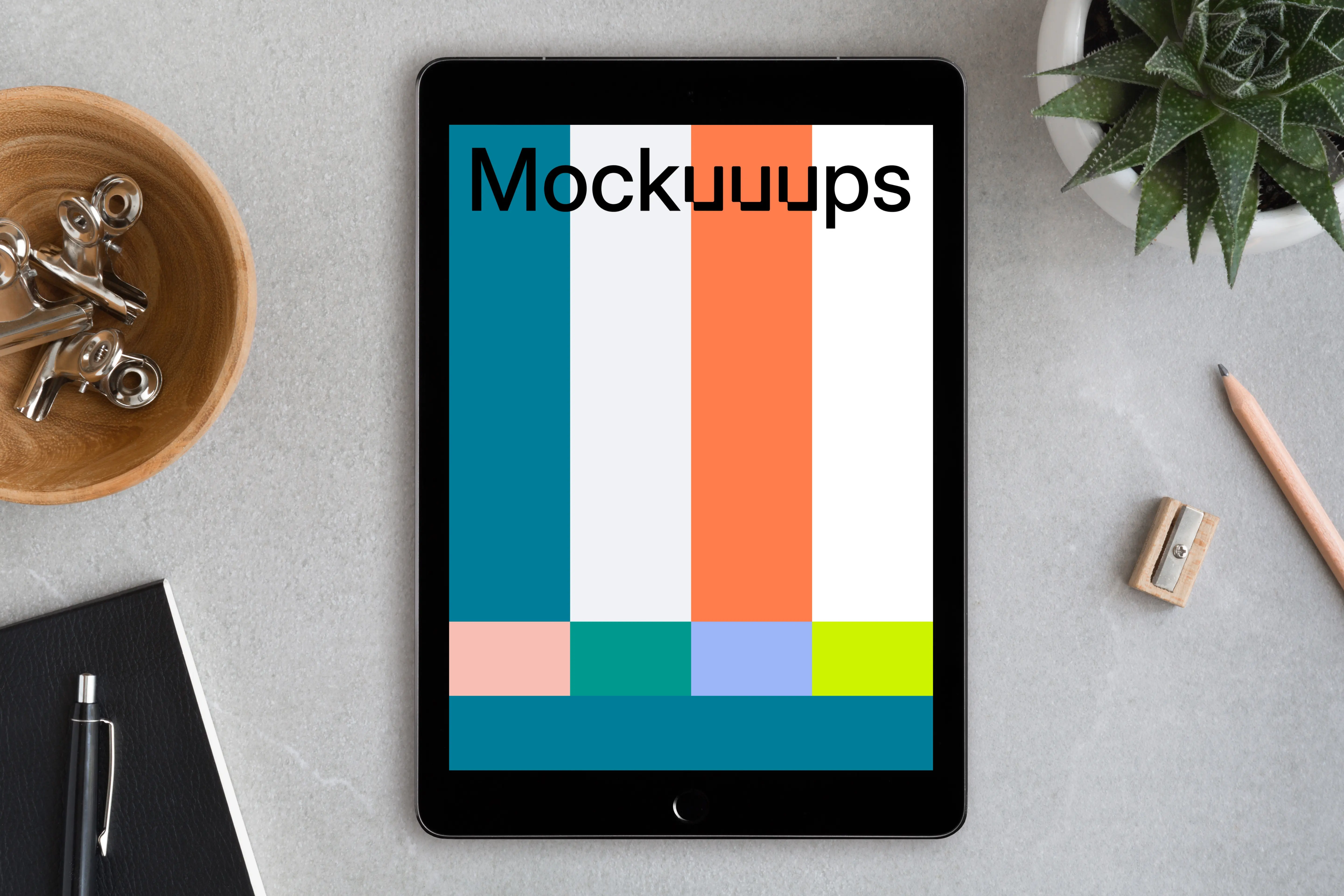 Center view of iPad Pro mockup on working desk