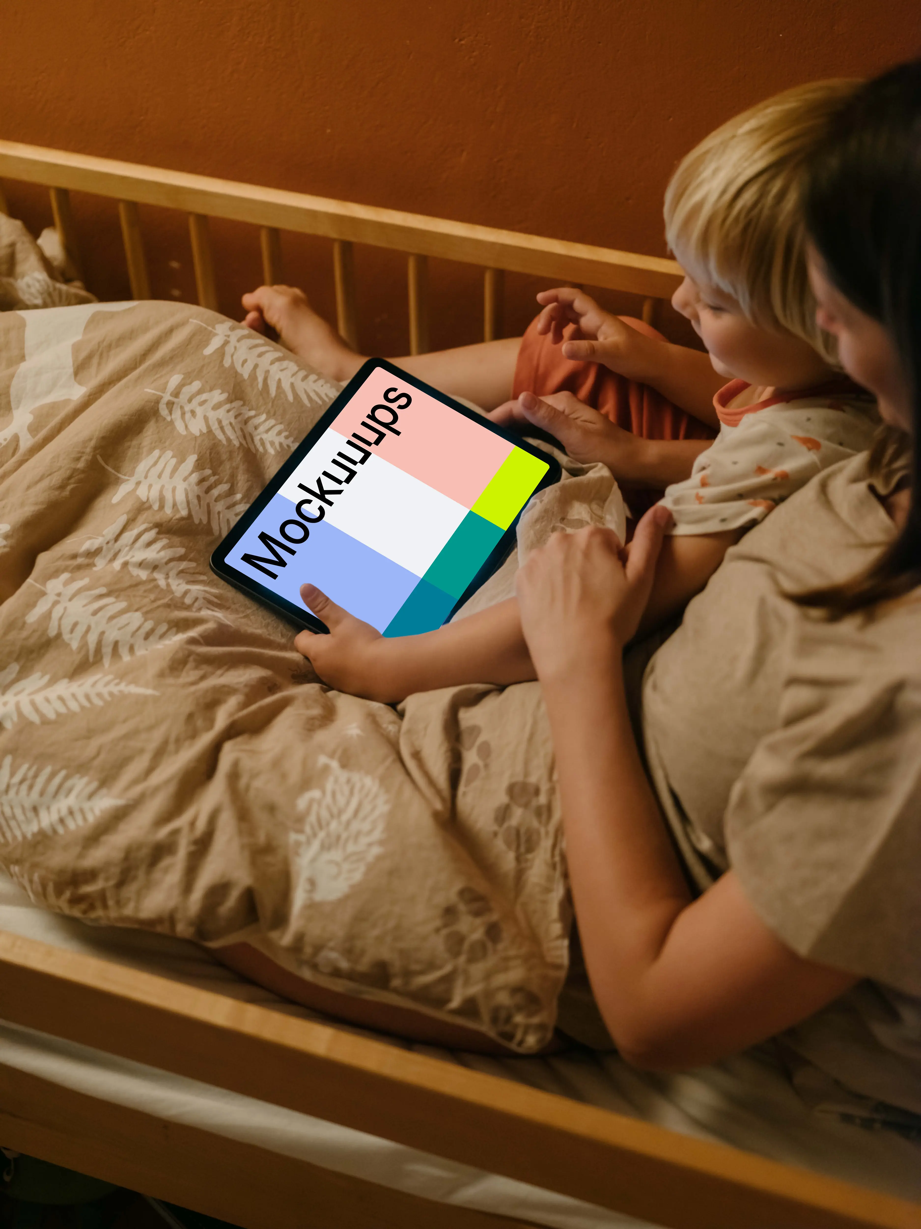 Child's hand holding an iPad Air mockup