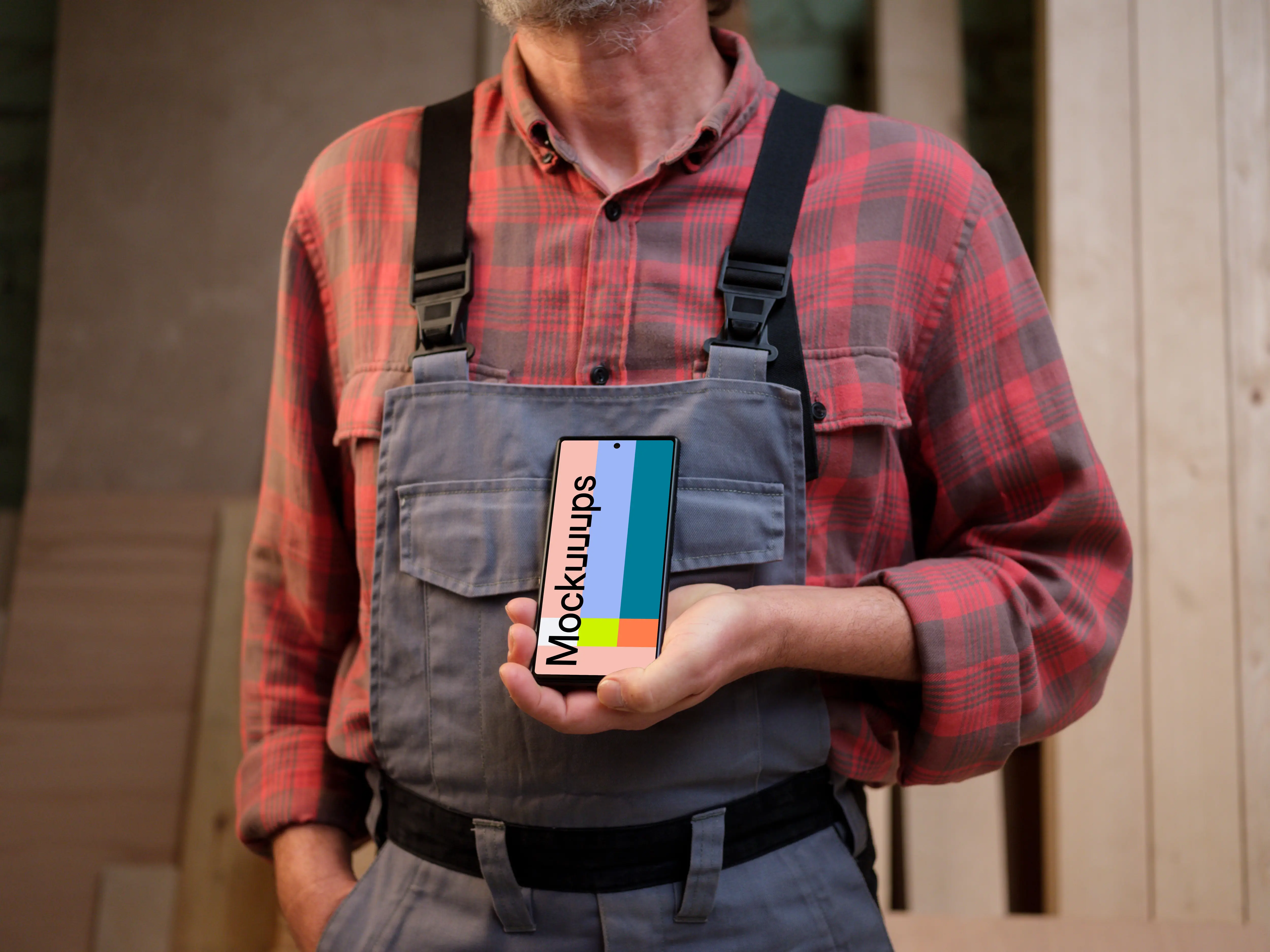 Crafter in overalls holding a Google Pixel 6 mockup