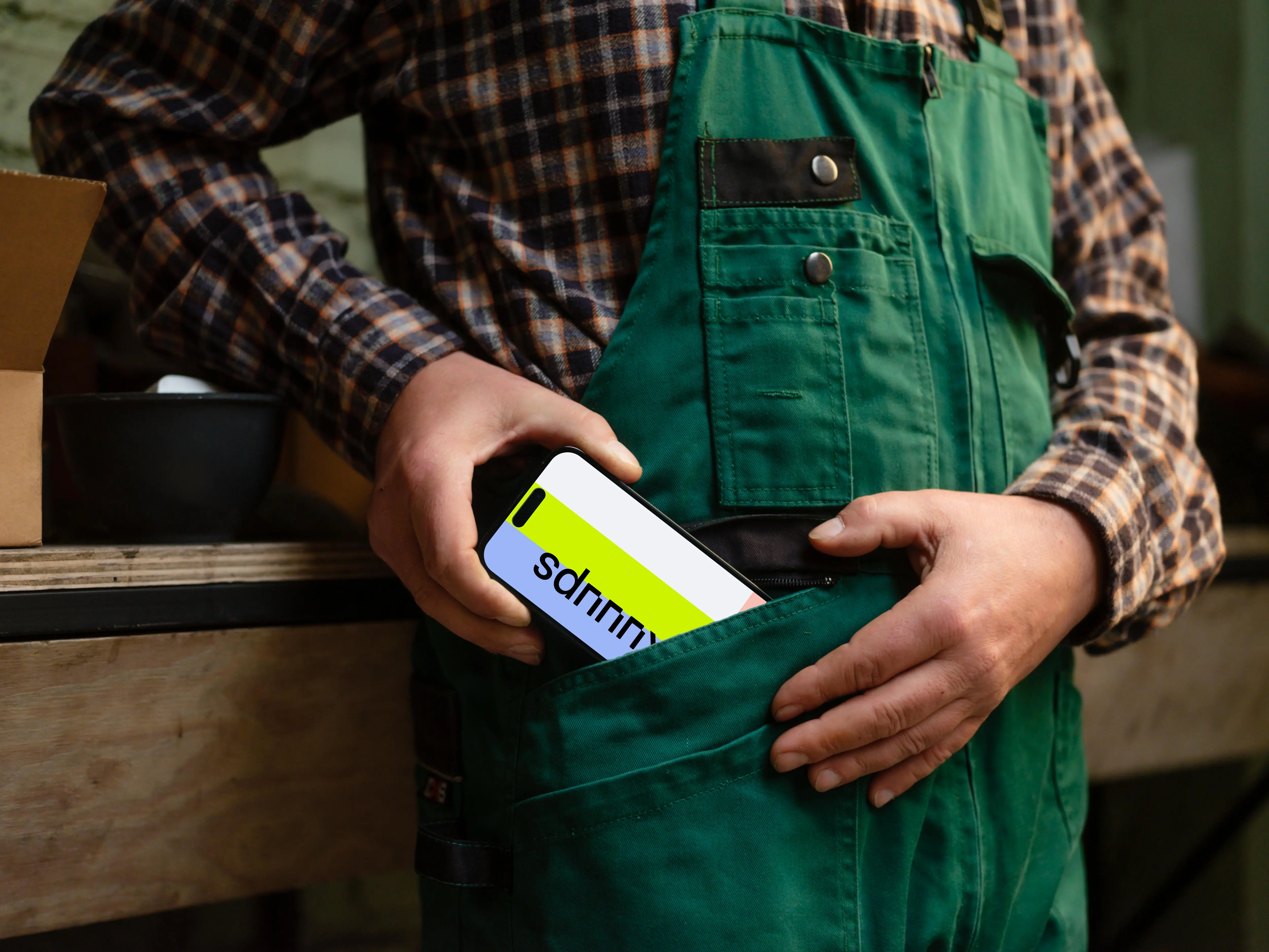 Crafter pulling out an iPhone from his pocket