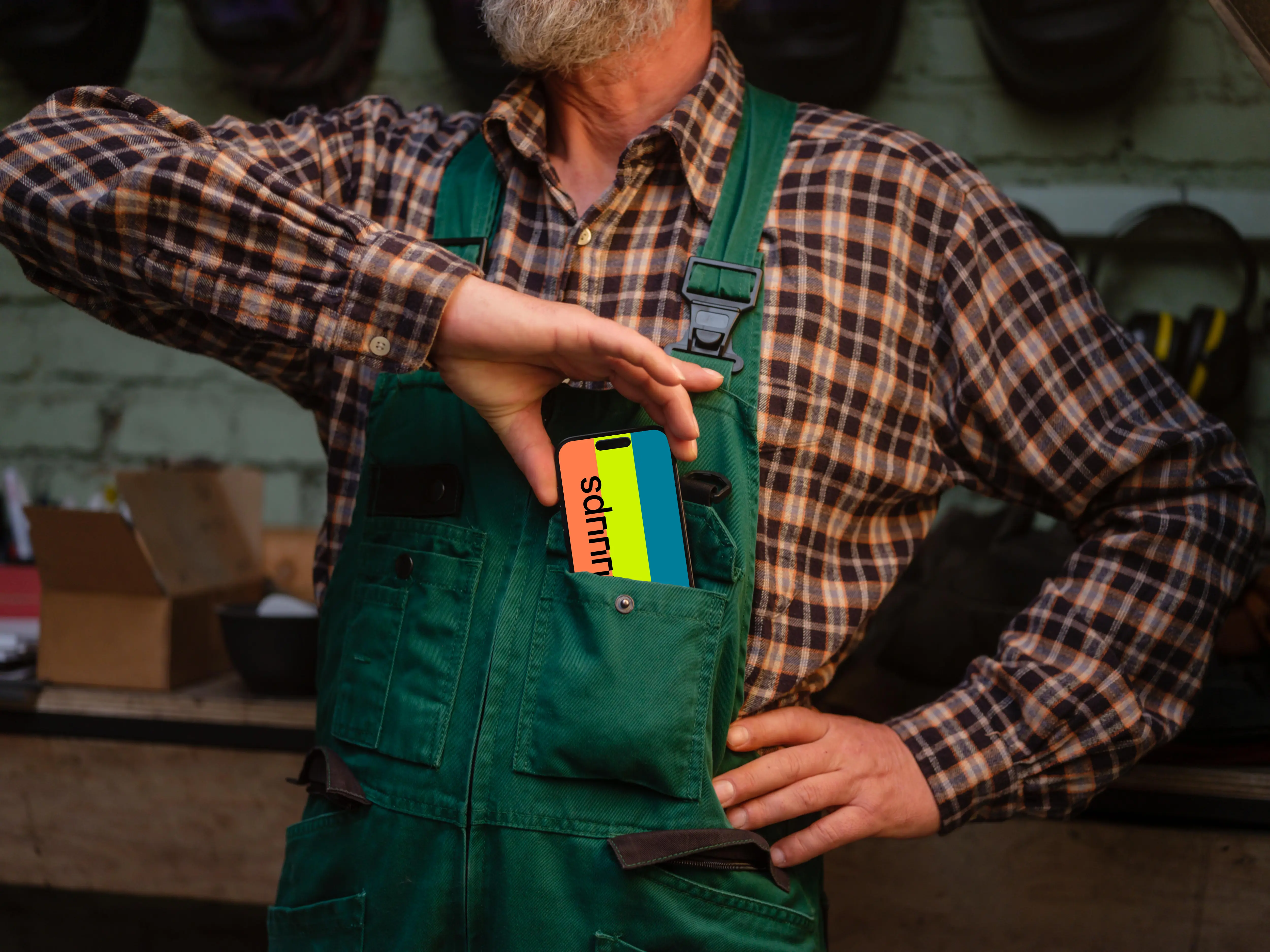 Crafter pulling out iPhone 14 Pro of his pocket