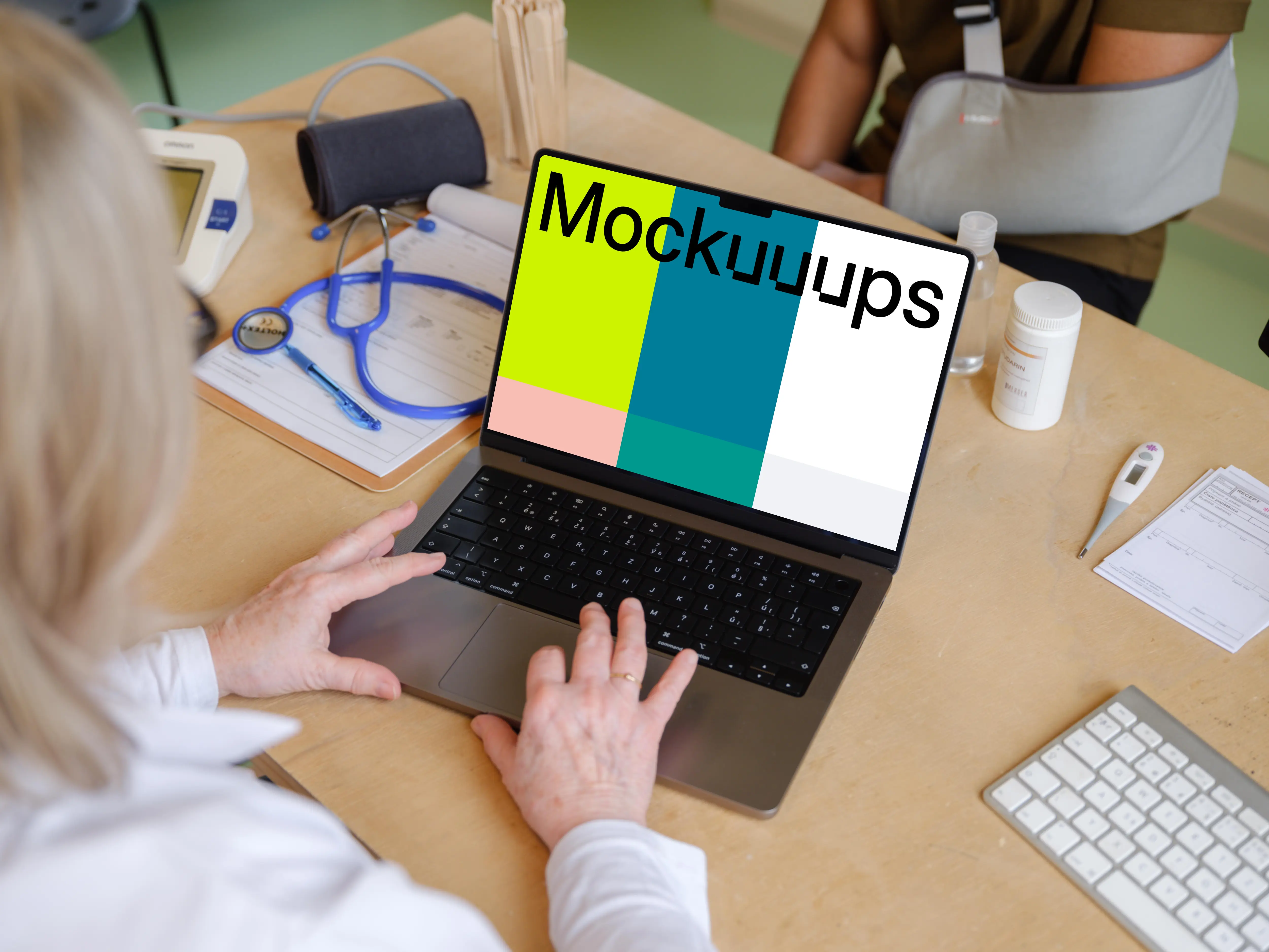 Doctor typing on a MacBook mockup