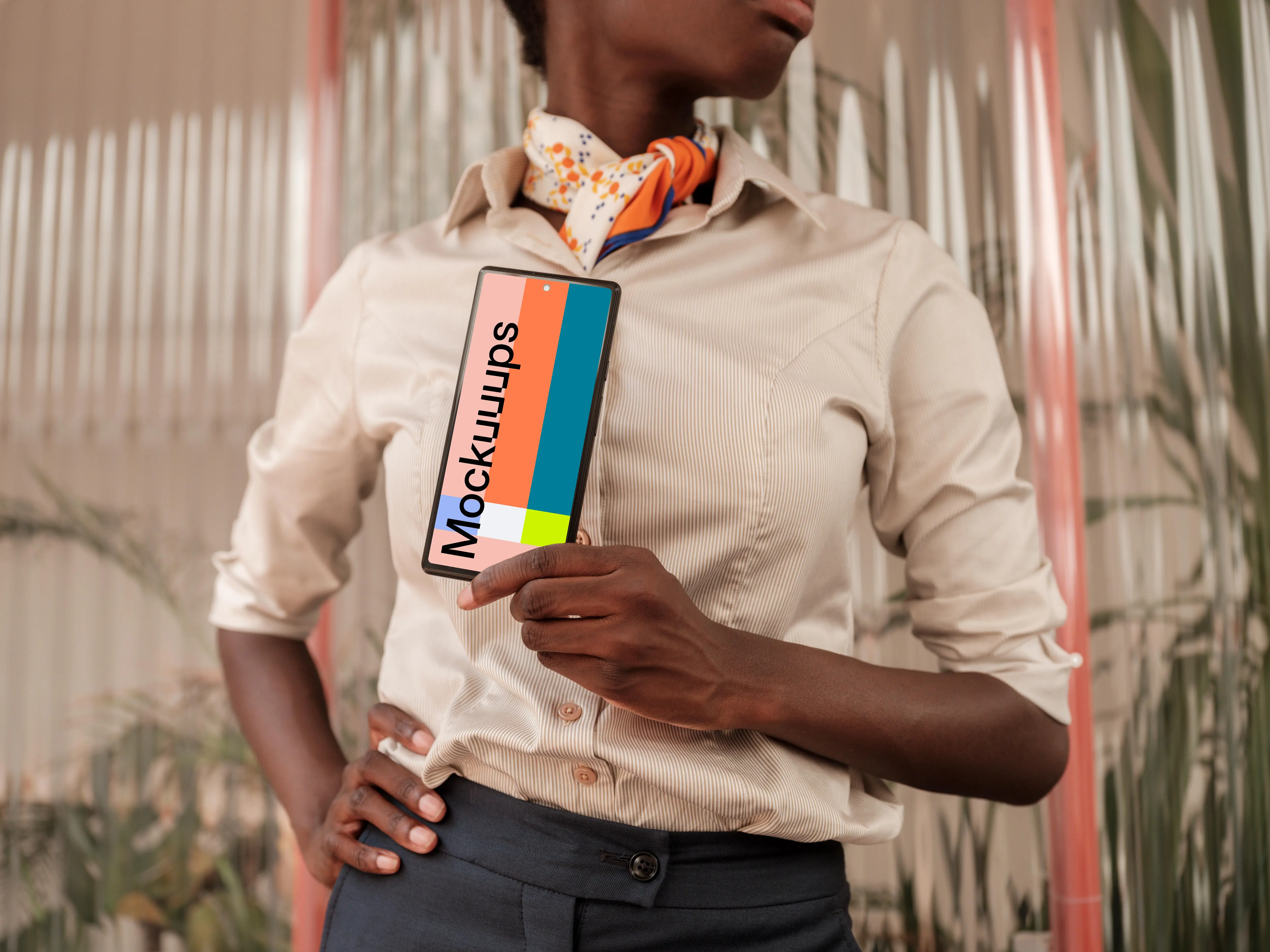 Female entrepreneur holding a Google Pixel mockup