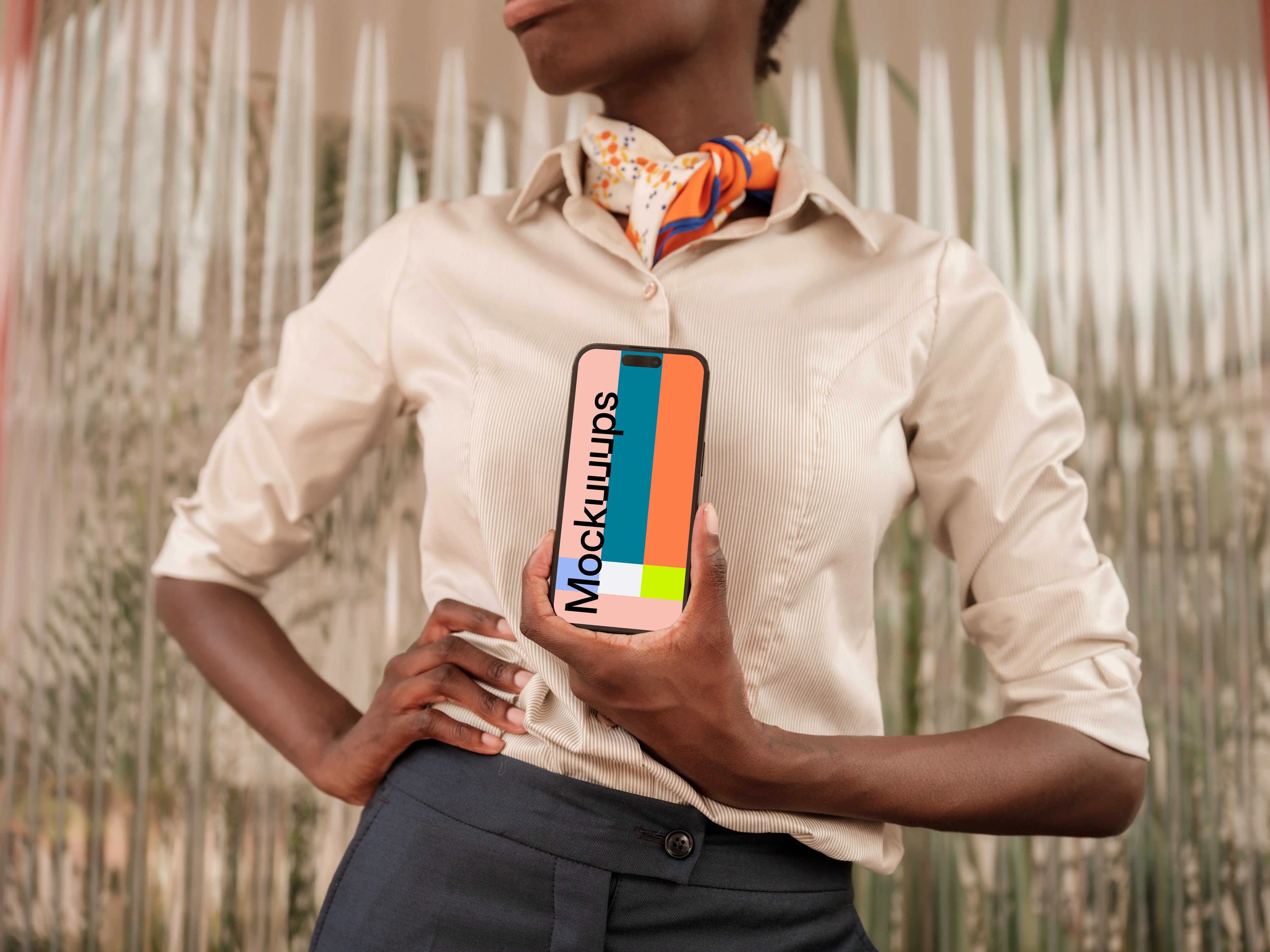 Female entrepreneur holding an iPhone mockup