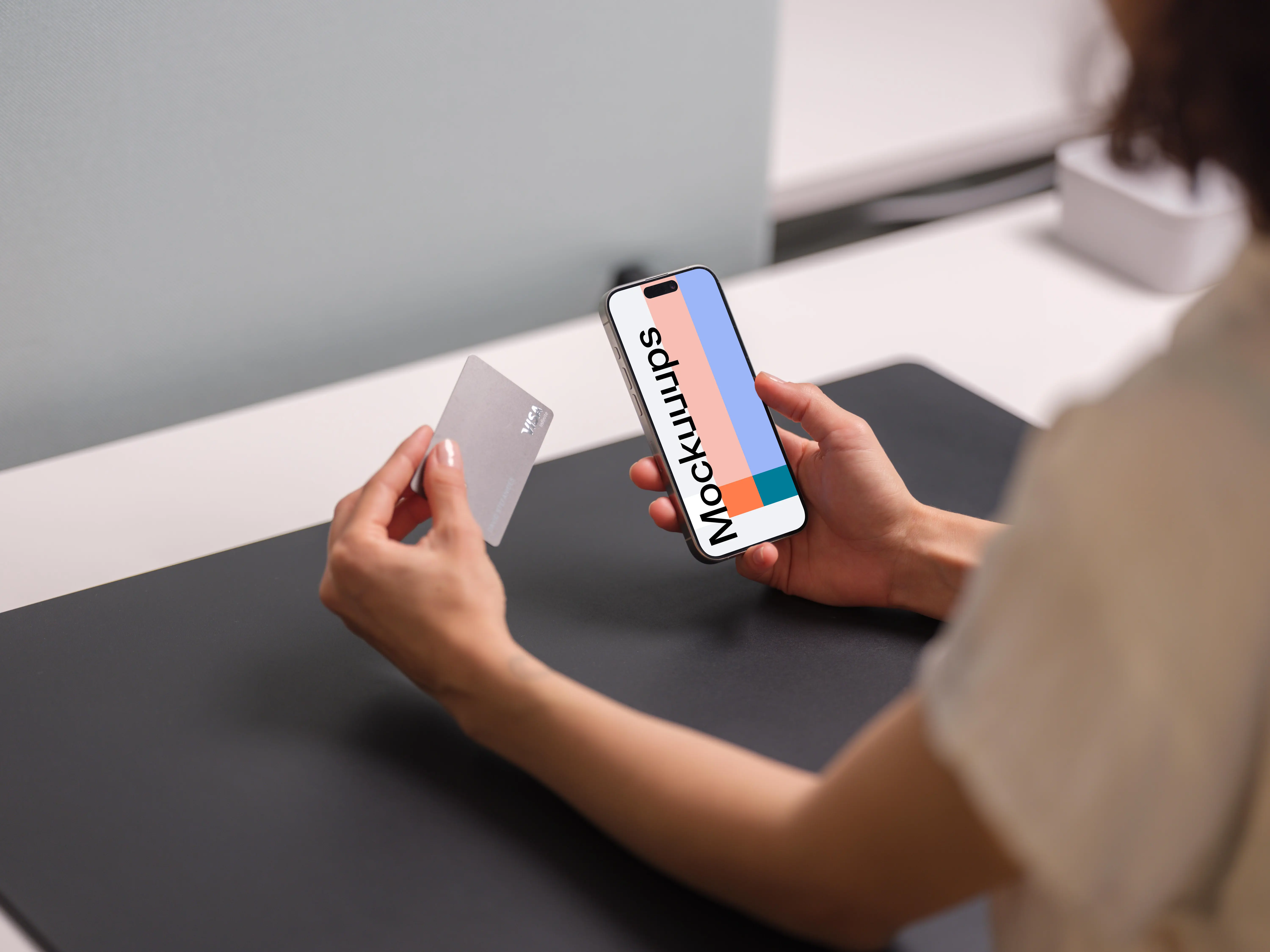 Free iPhone 15 Pro mockup with credit card in hand