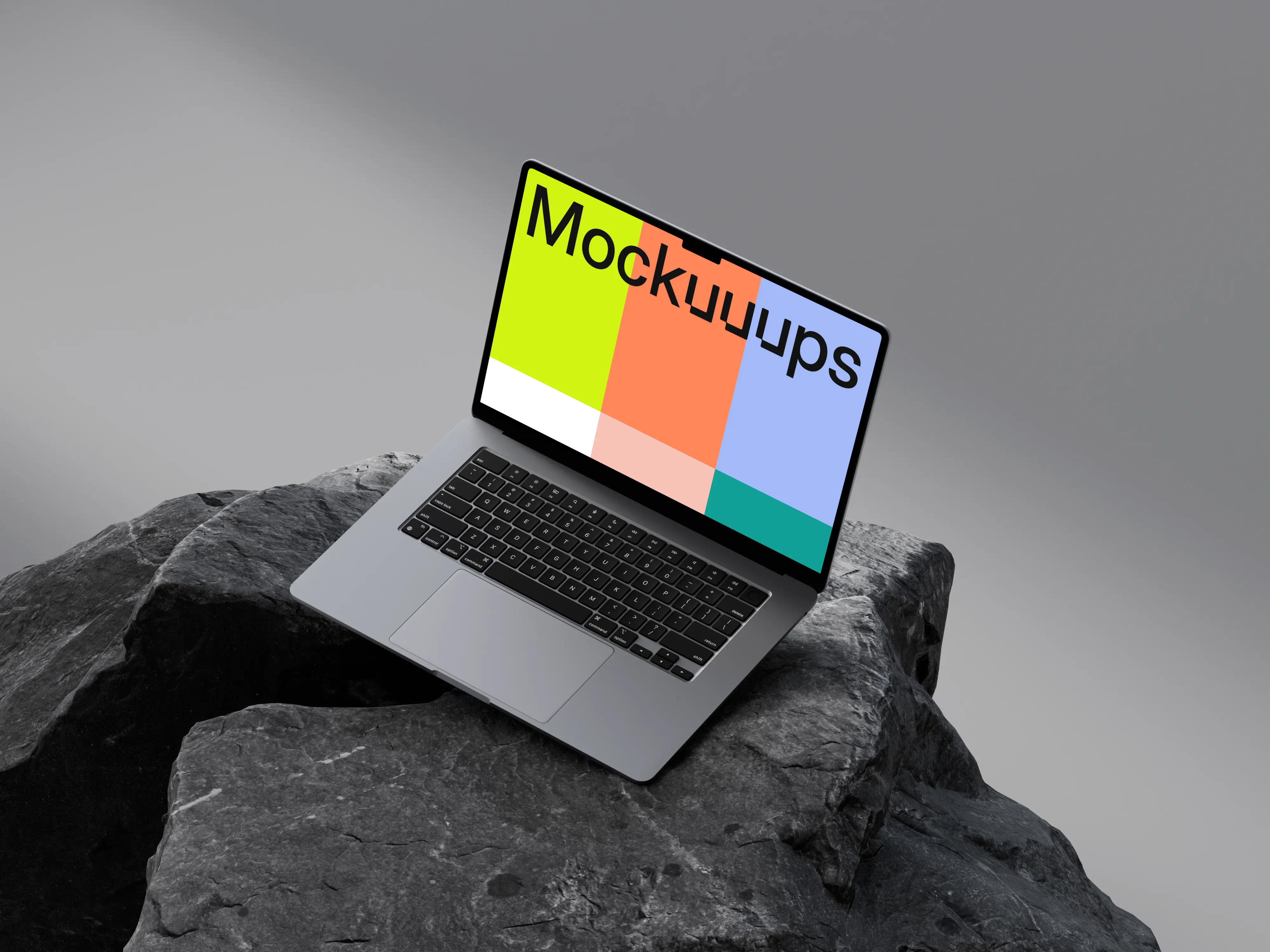 Free MacBook Air 15" mockup on dark textured rocks