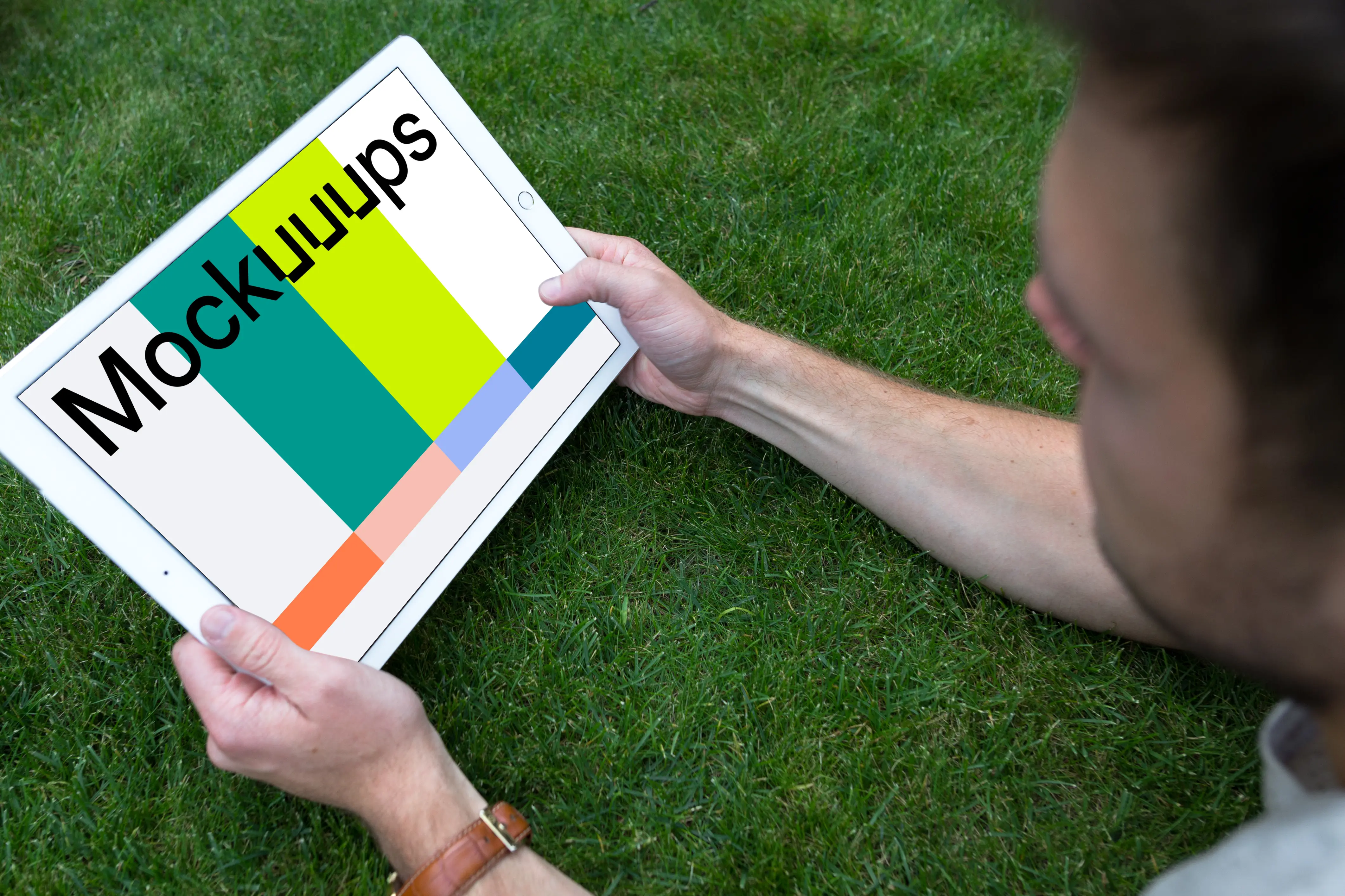 Holding iPad Pro mockup (Landscape)