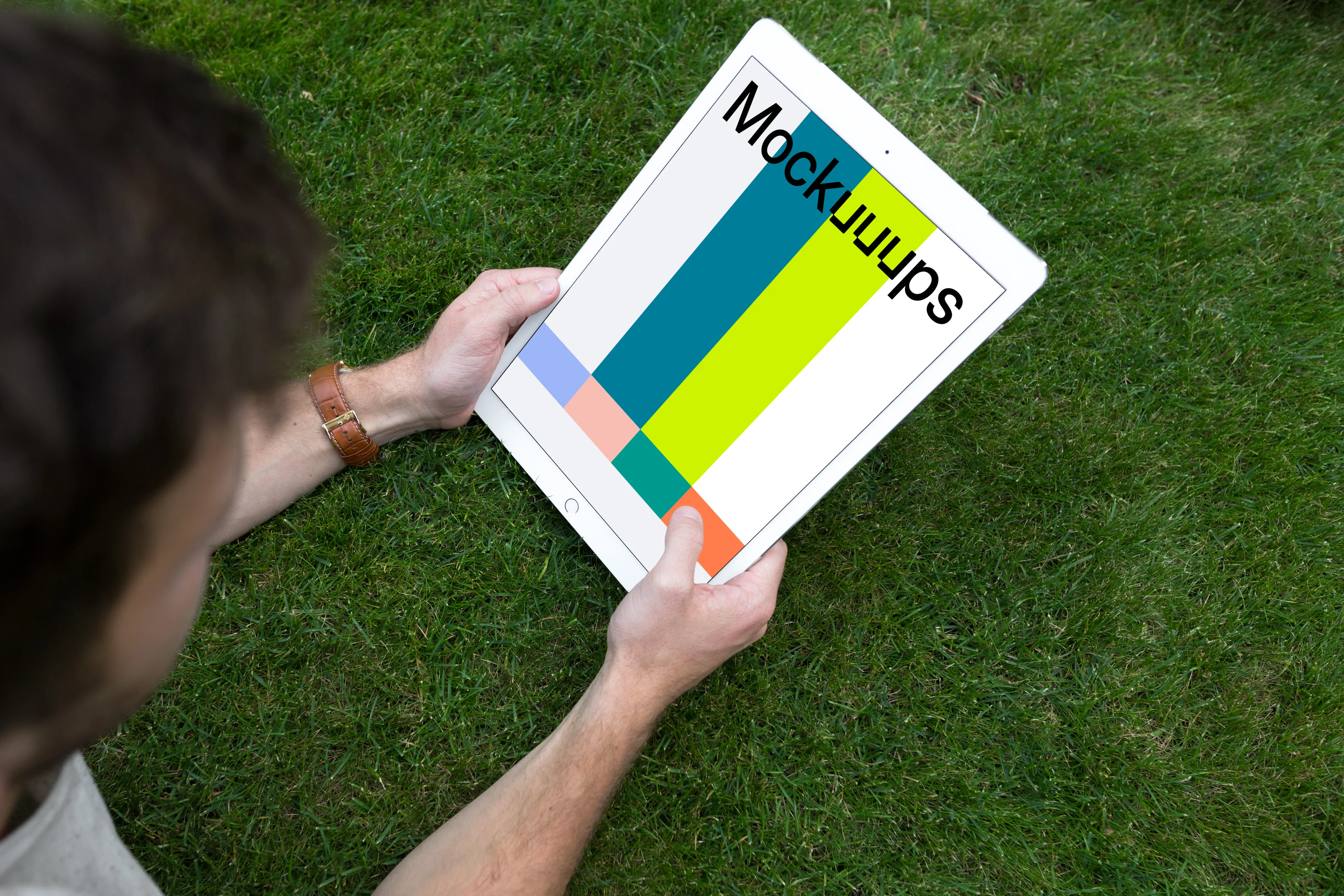 Holding iPad Pro mockup on the green background