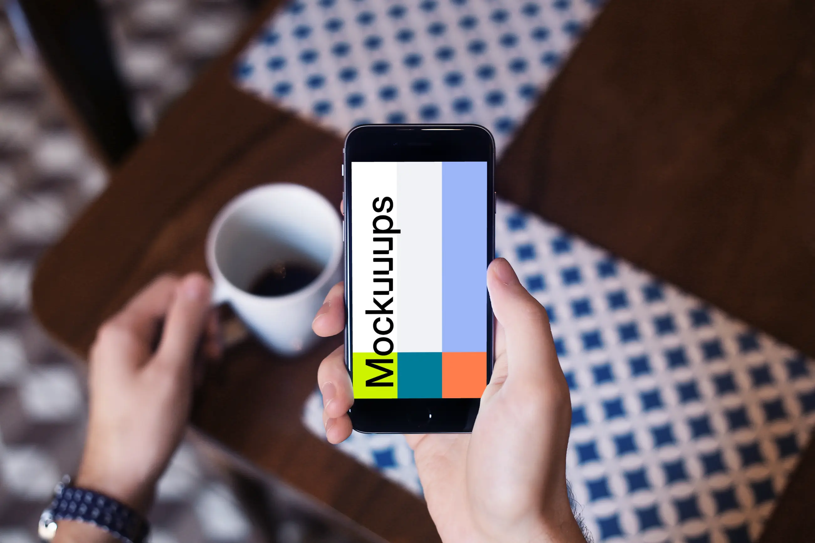 Holding iPhone 6 mockup and drinking coffee