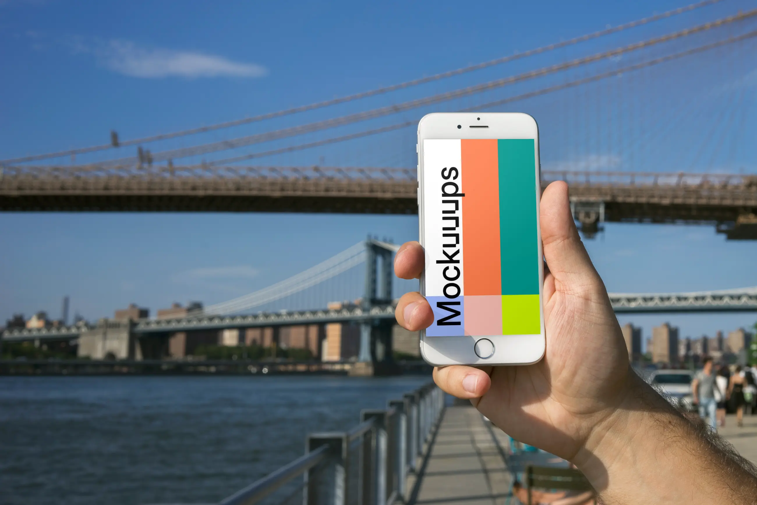 Holding iPhone 6 mockup in front of Brooklyn Bridge