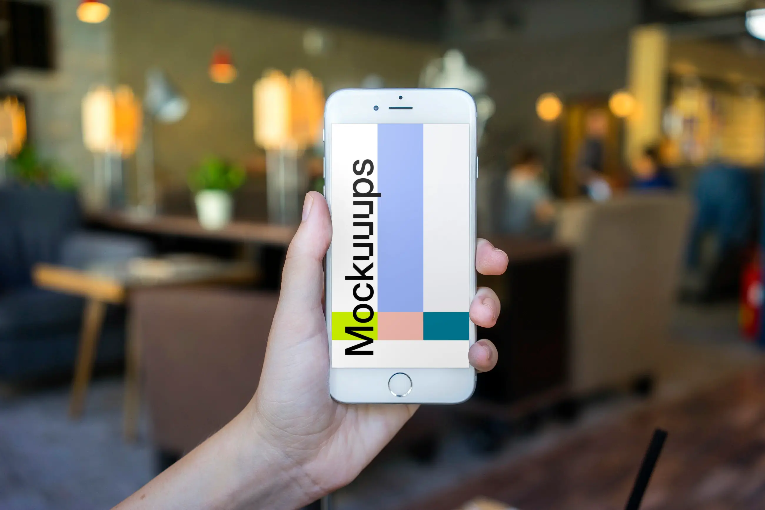 Holding iPhone 6 mockup in shop