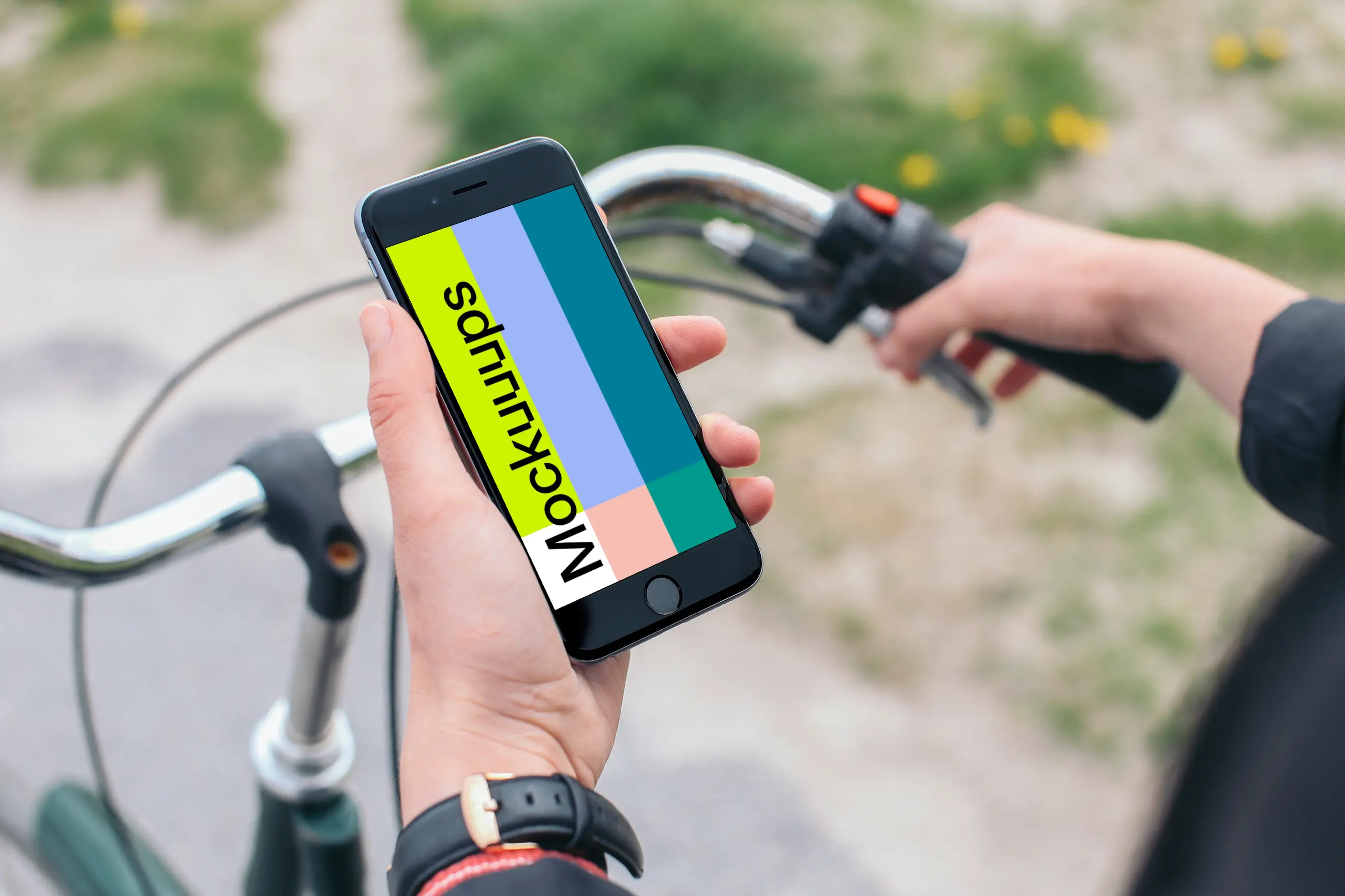 Holding iPhone 6 mockup on a bike