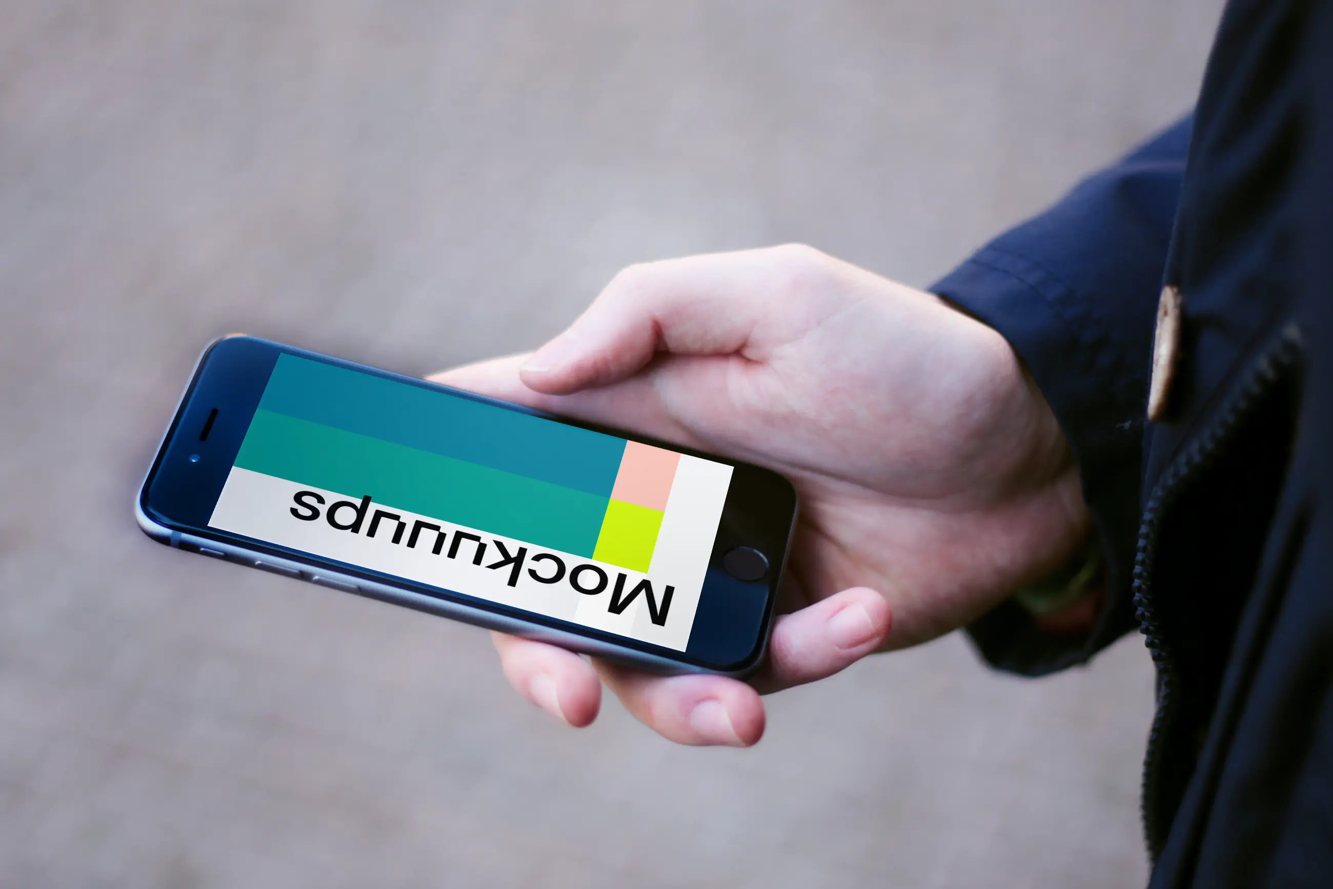 Holding iPhone 6 mockup on the street