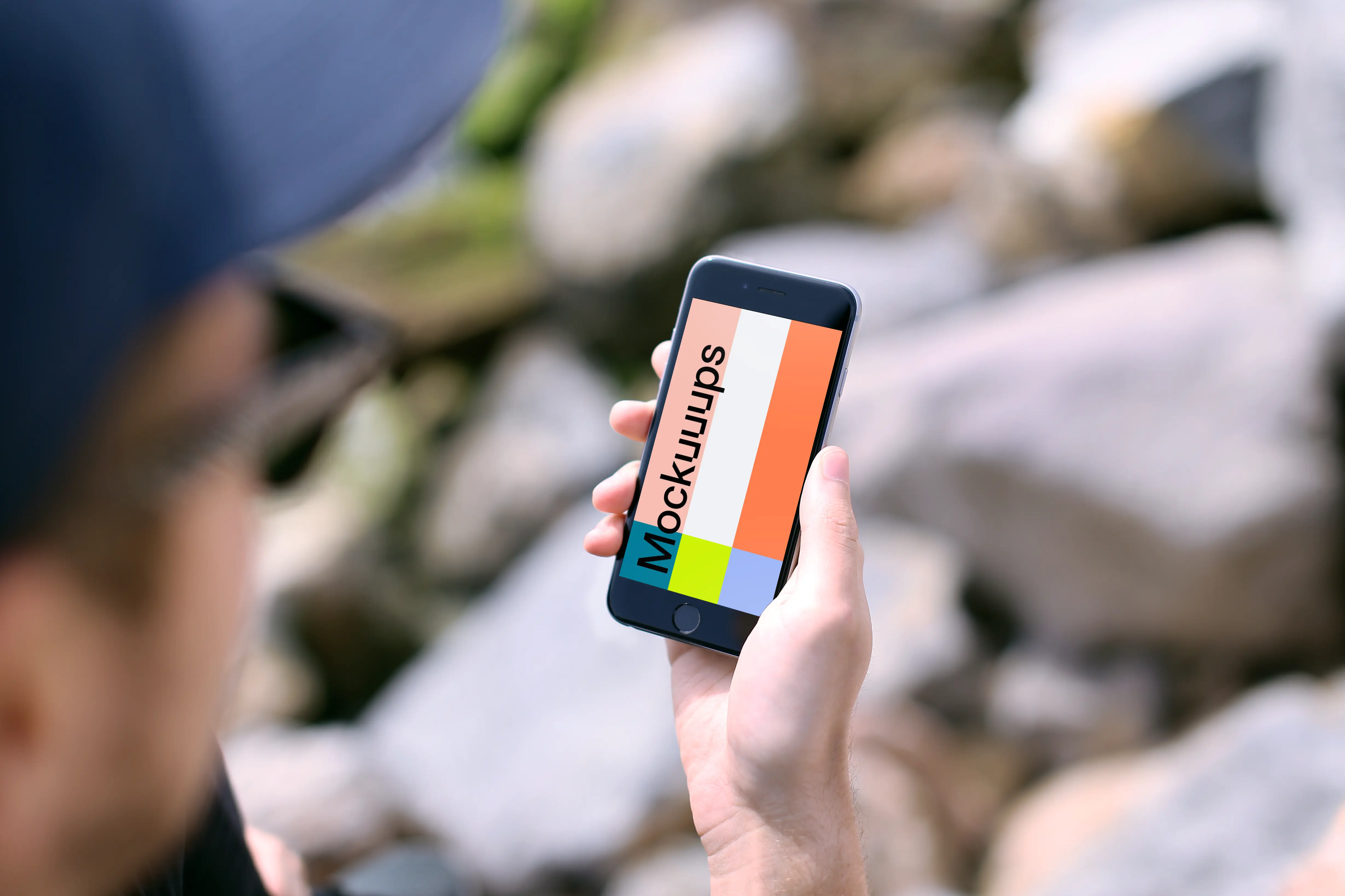 Holding iPhone 6s mockup during sunny day