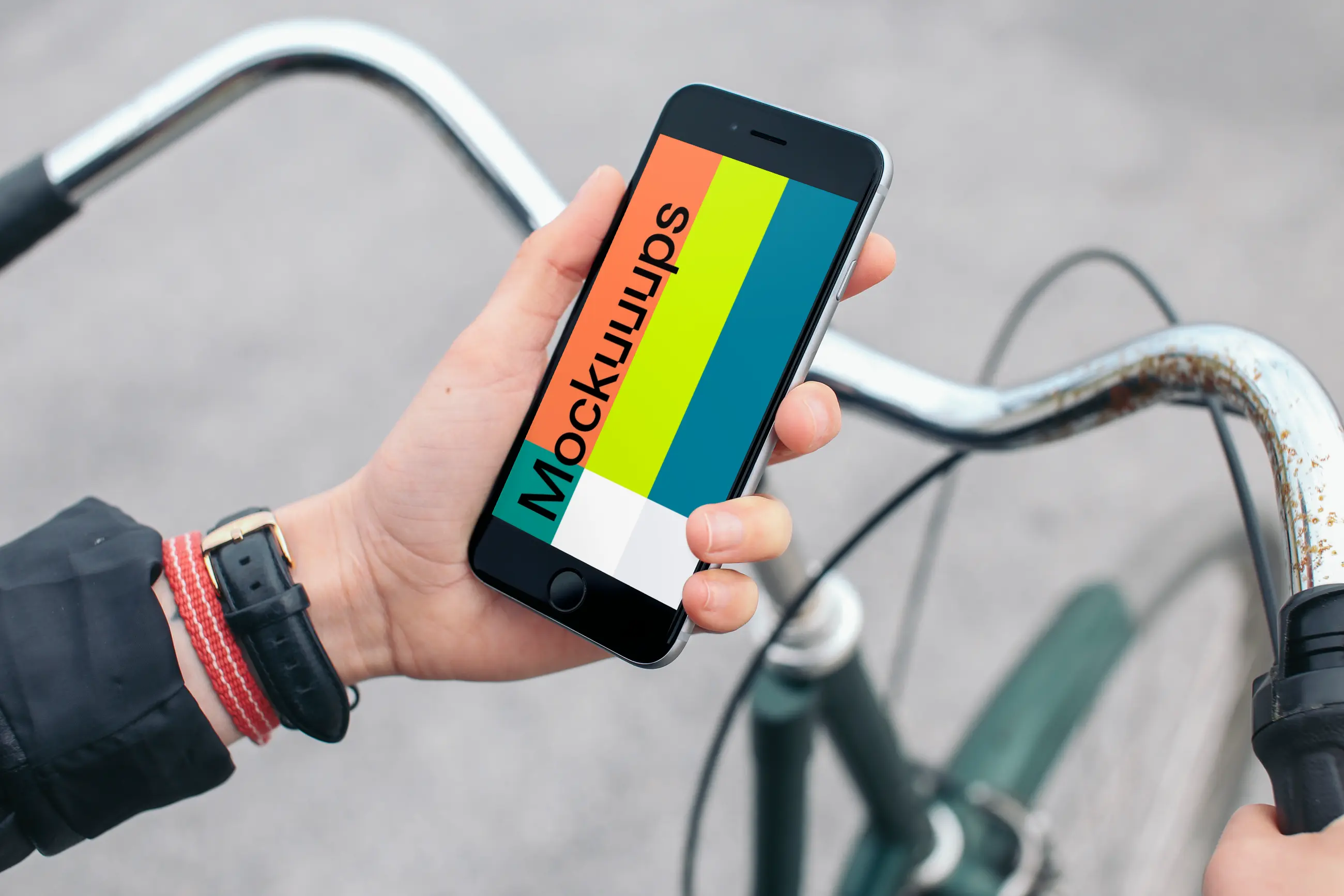 Holding iPhone 6s Space Gray mockup on bike