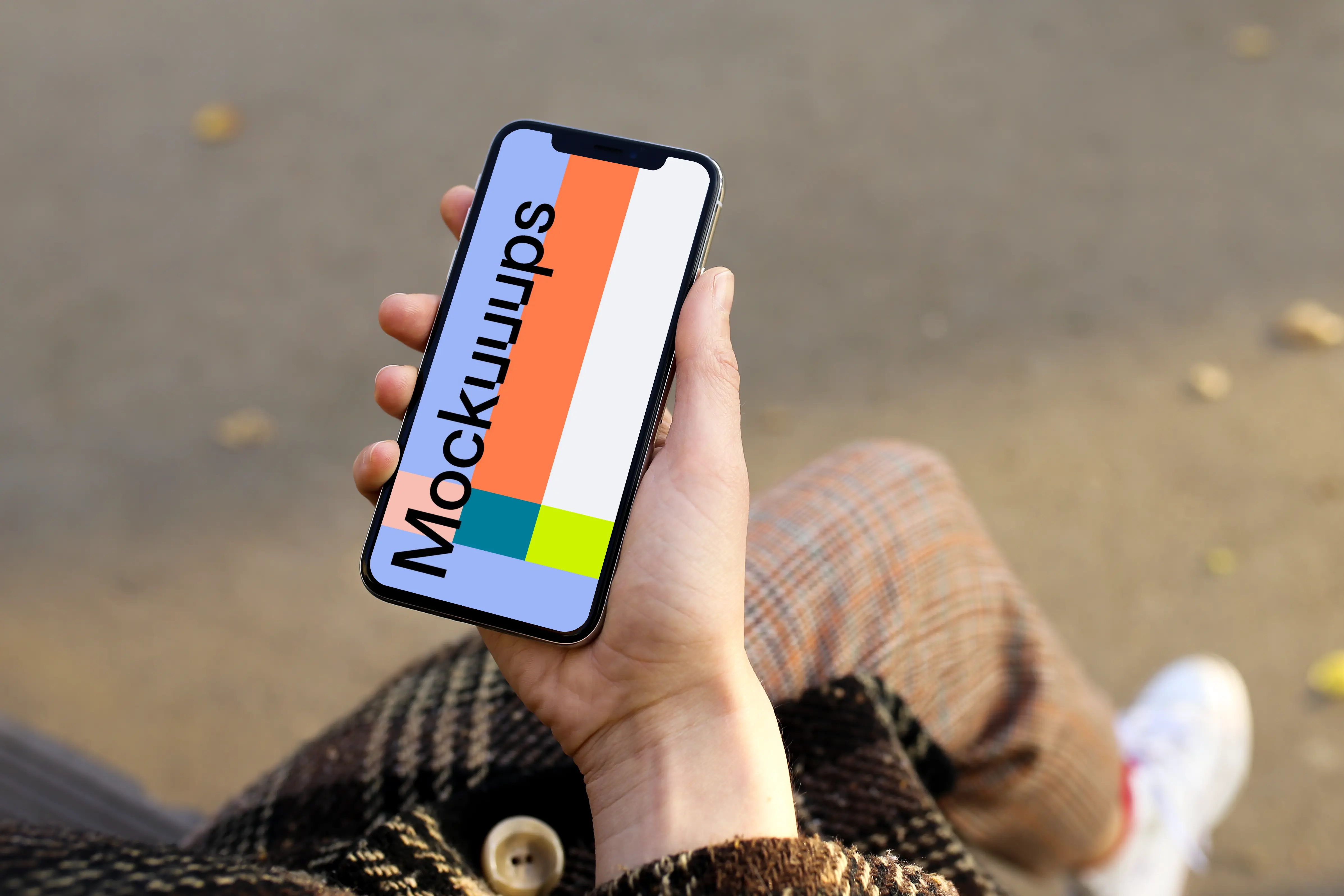 Holding iPhone X mockup