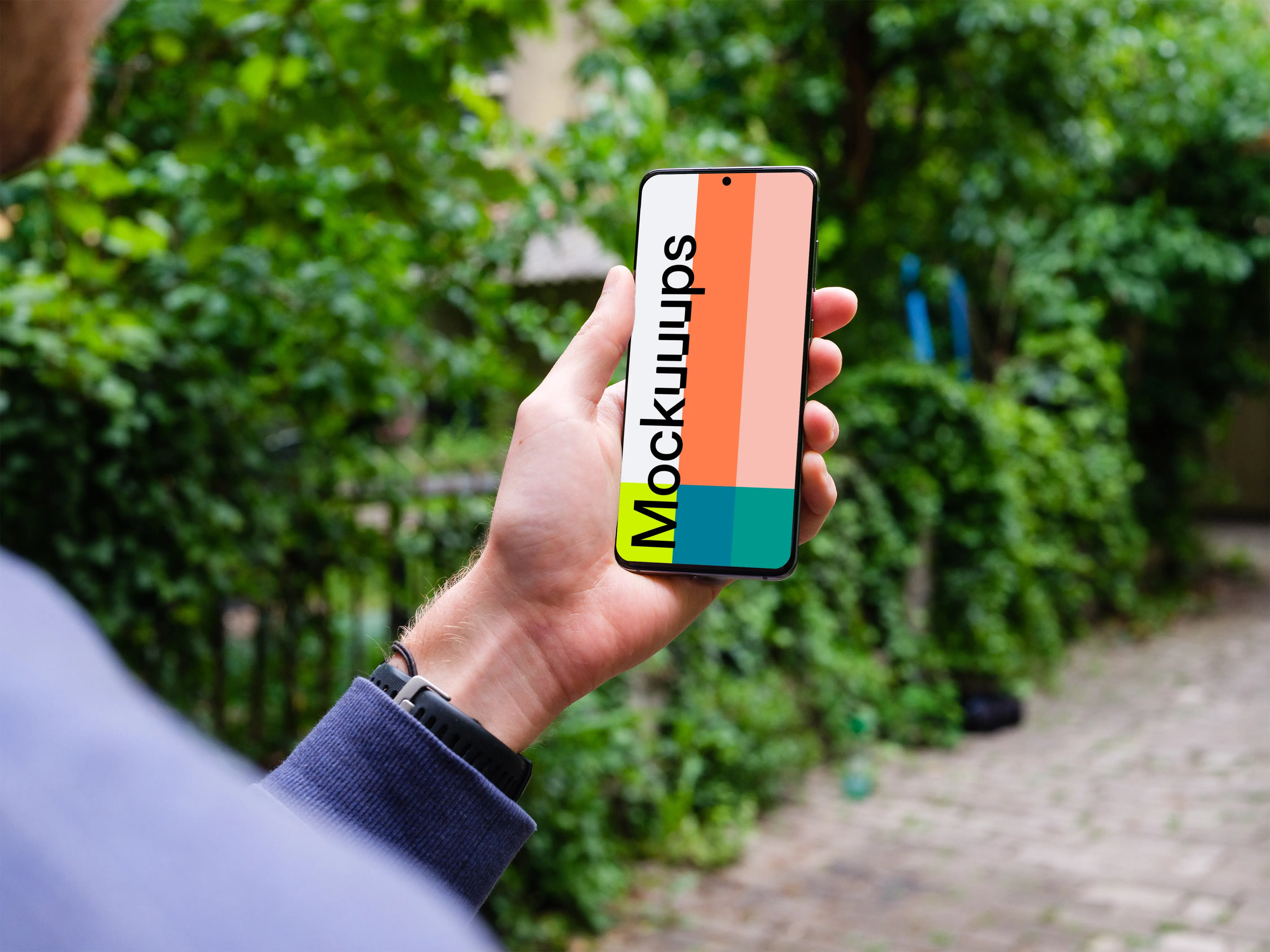 Holding Samsung Galaxy S20 mockup amongst trees