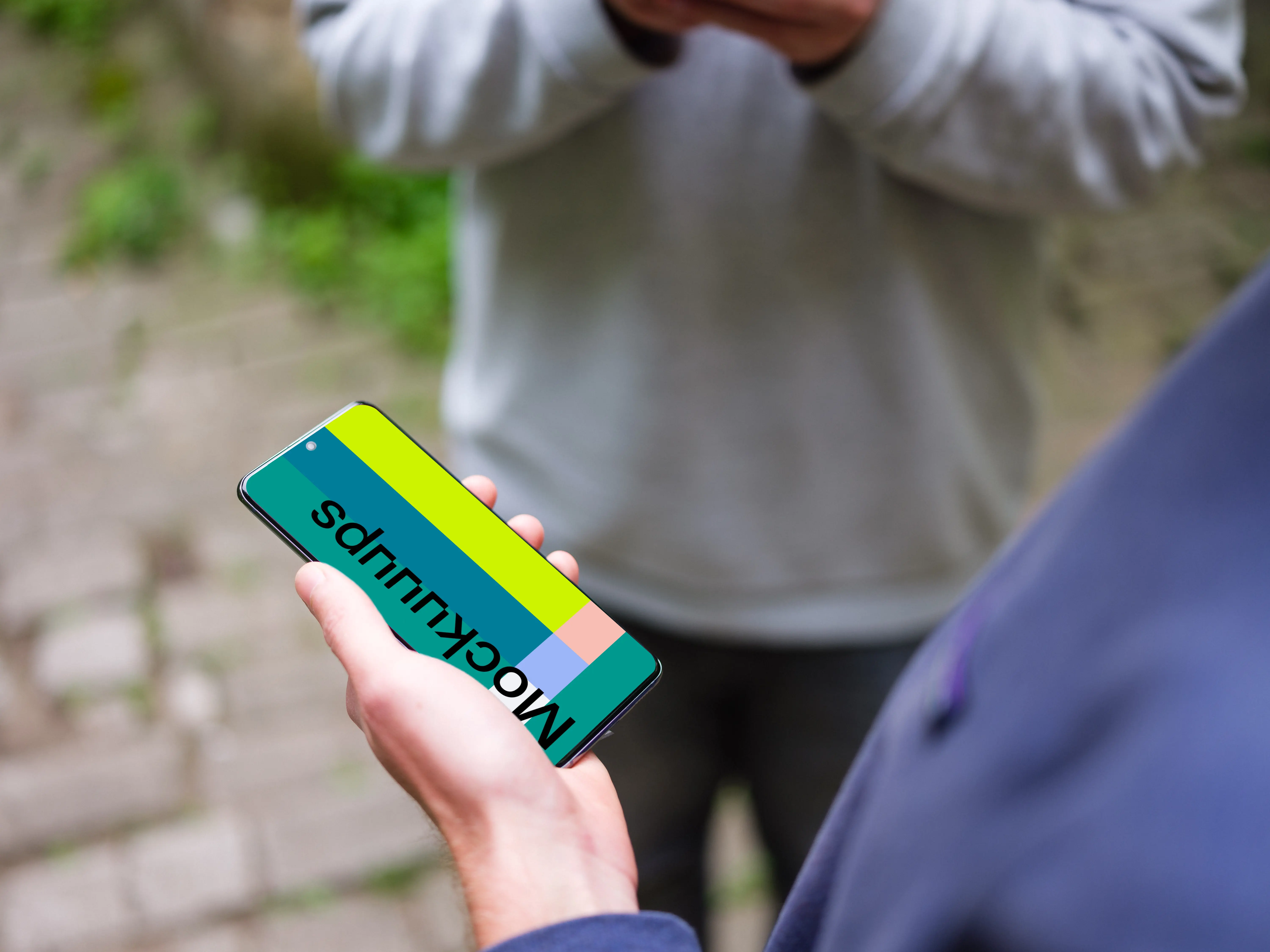 Holding Samsung Galaxy S20 mockup next to a friend