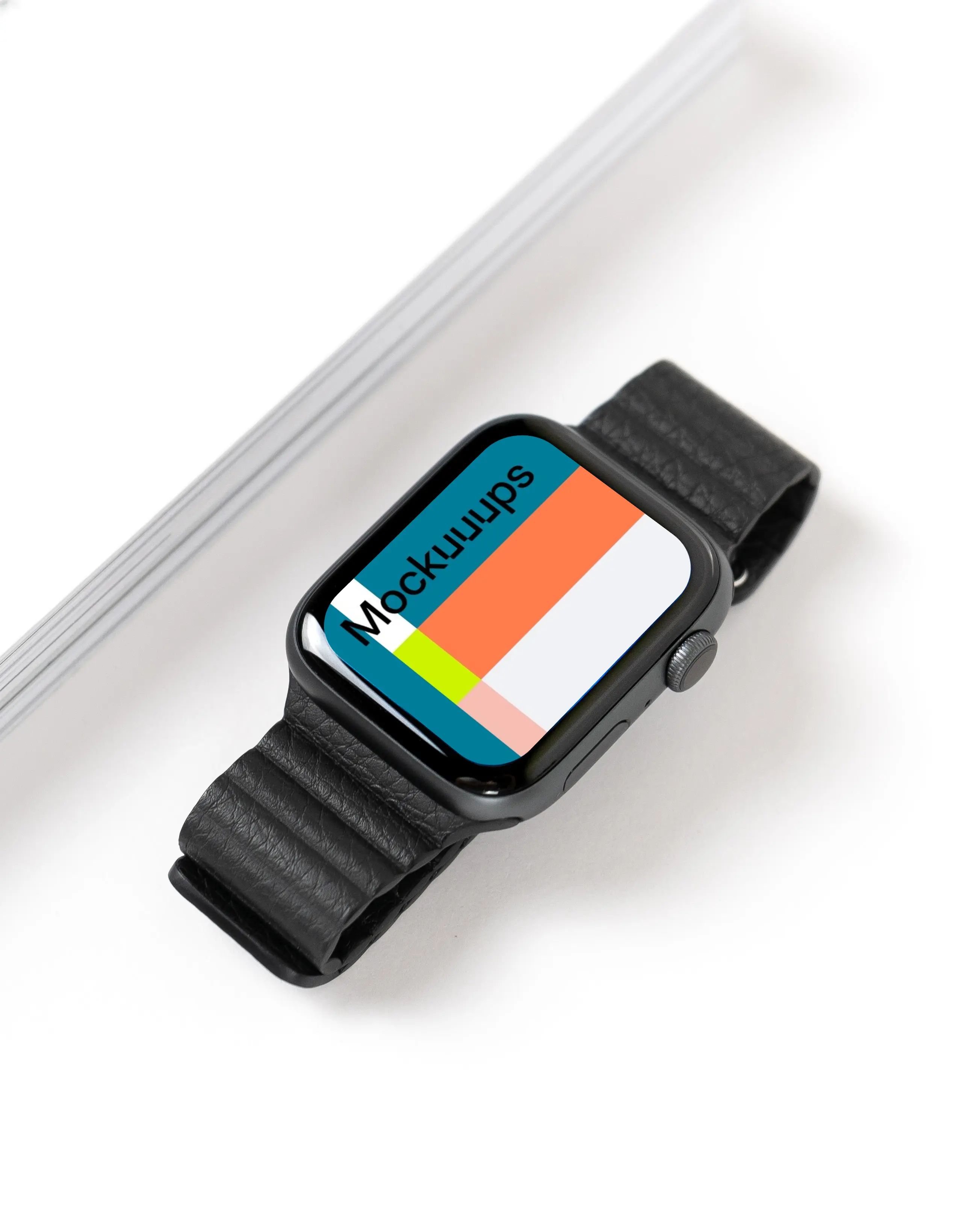 Apple Watch mockup on table beside a book