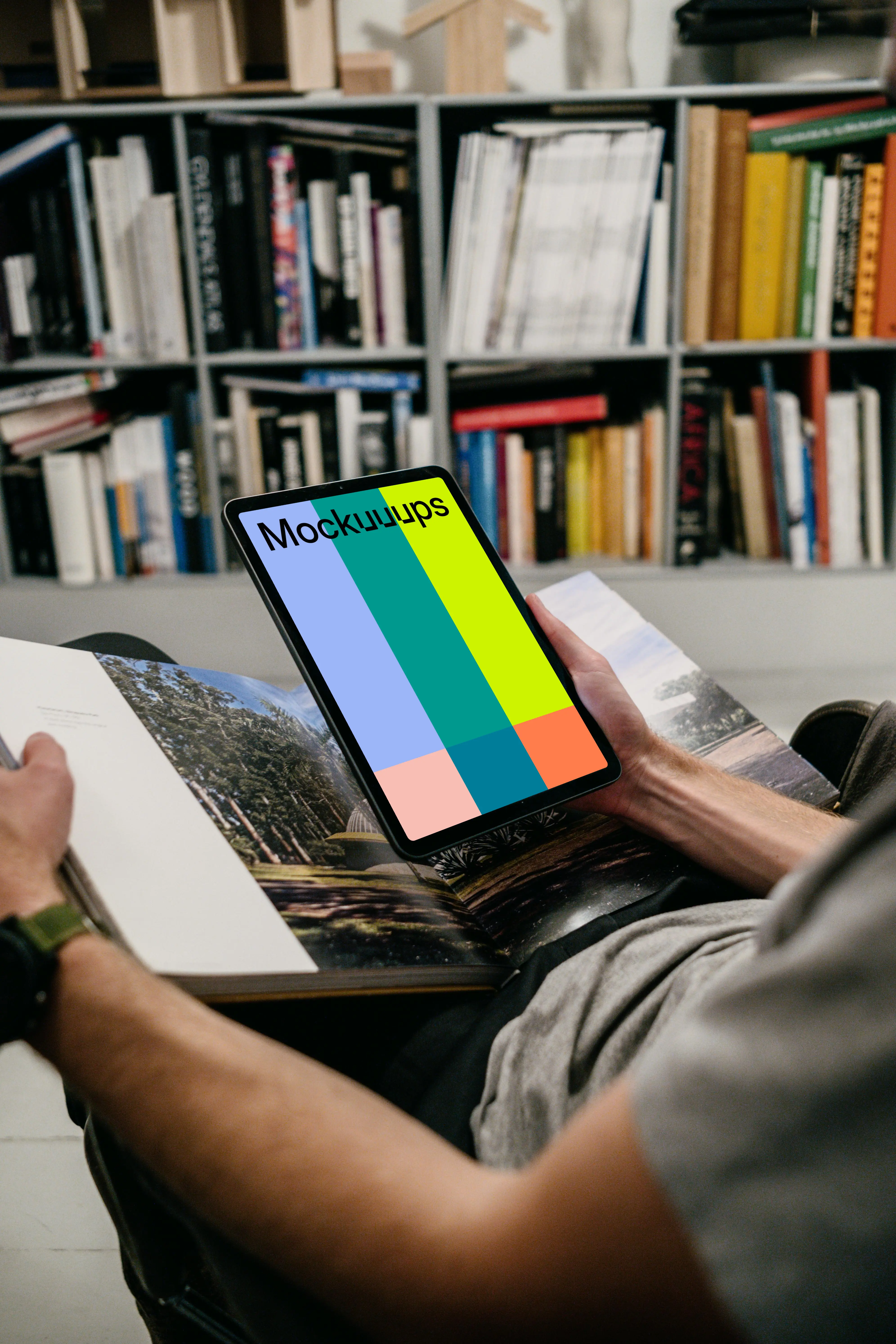 iPad Air mockup held by user in a library