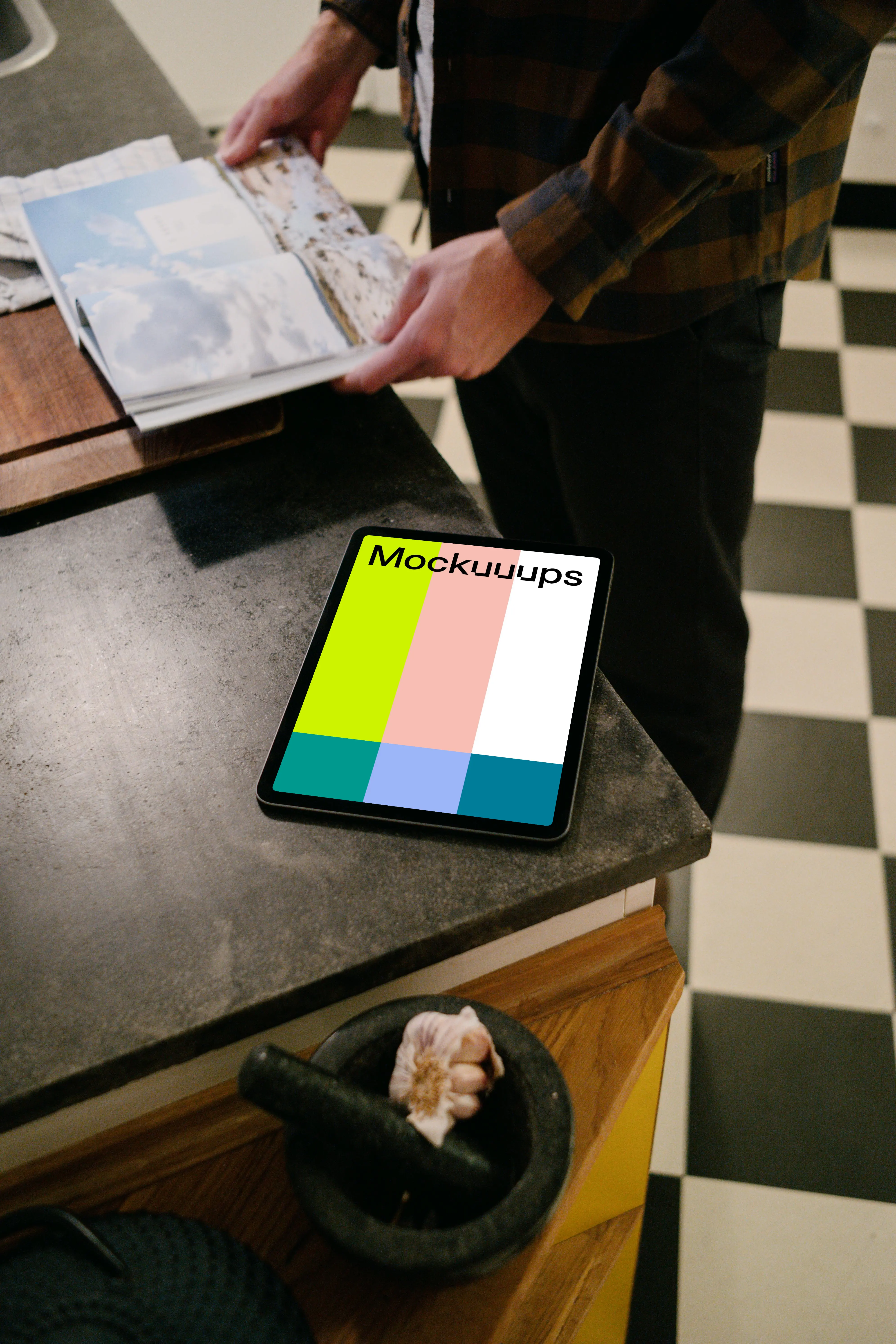 iPad Air mockup on a black table next to a user