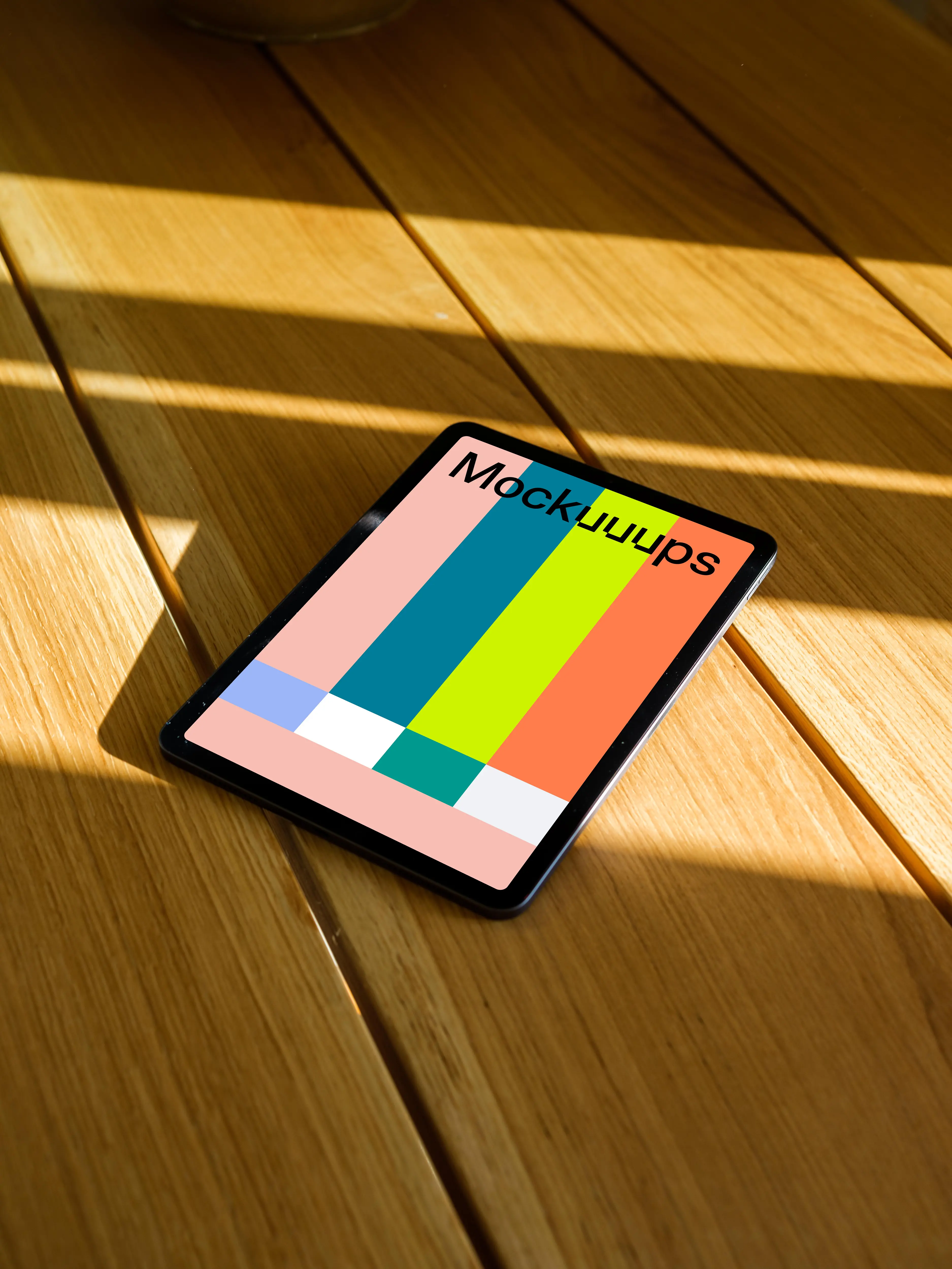 iPad Air mockup on a wooden table in the sunlight