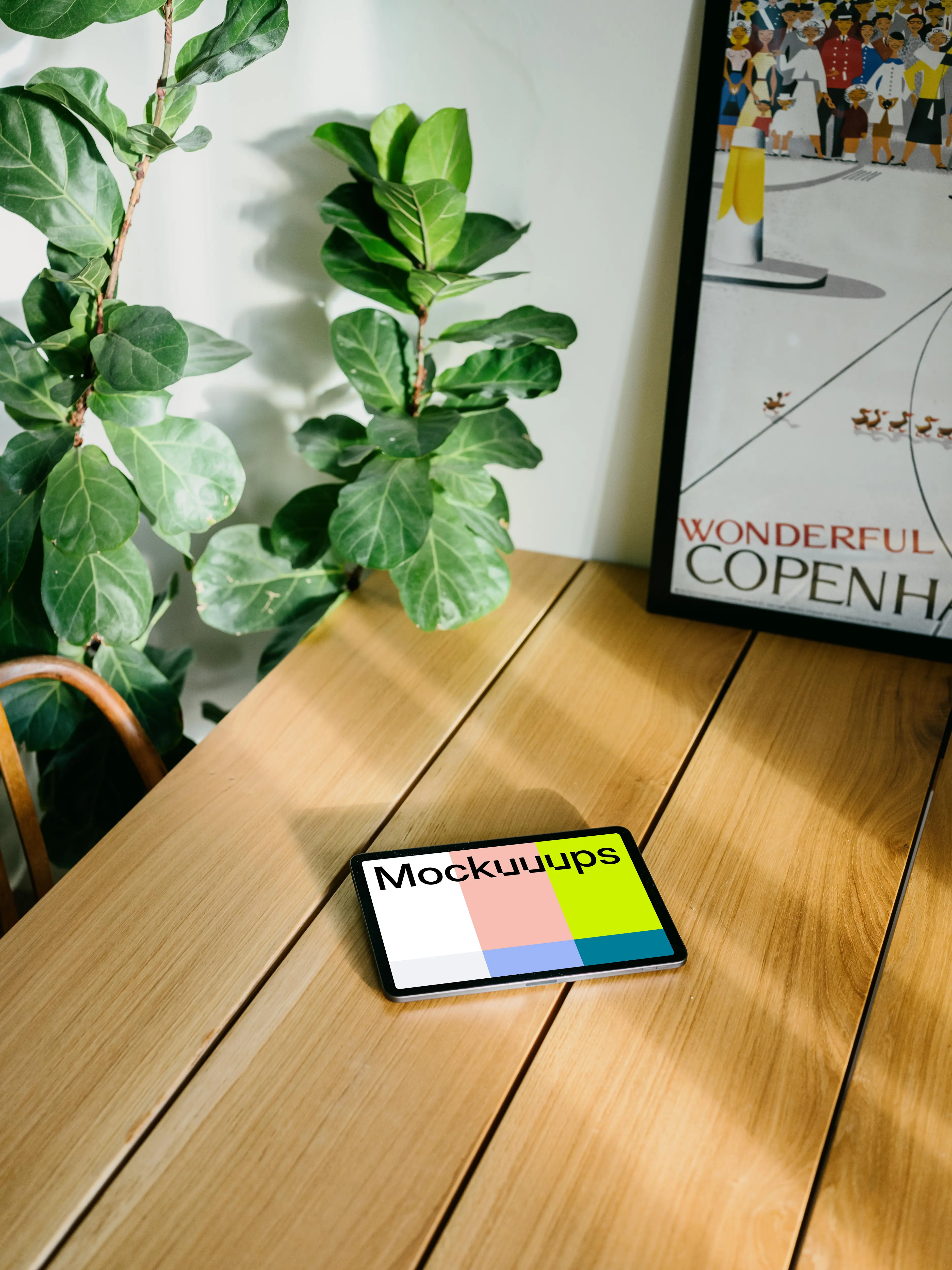 iPad Air mockup with a framed photo in the background