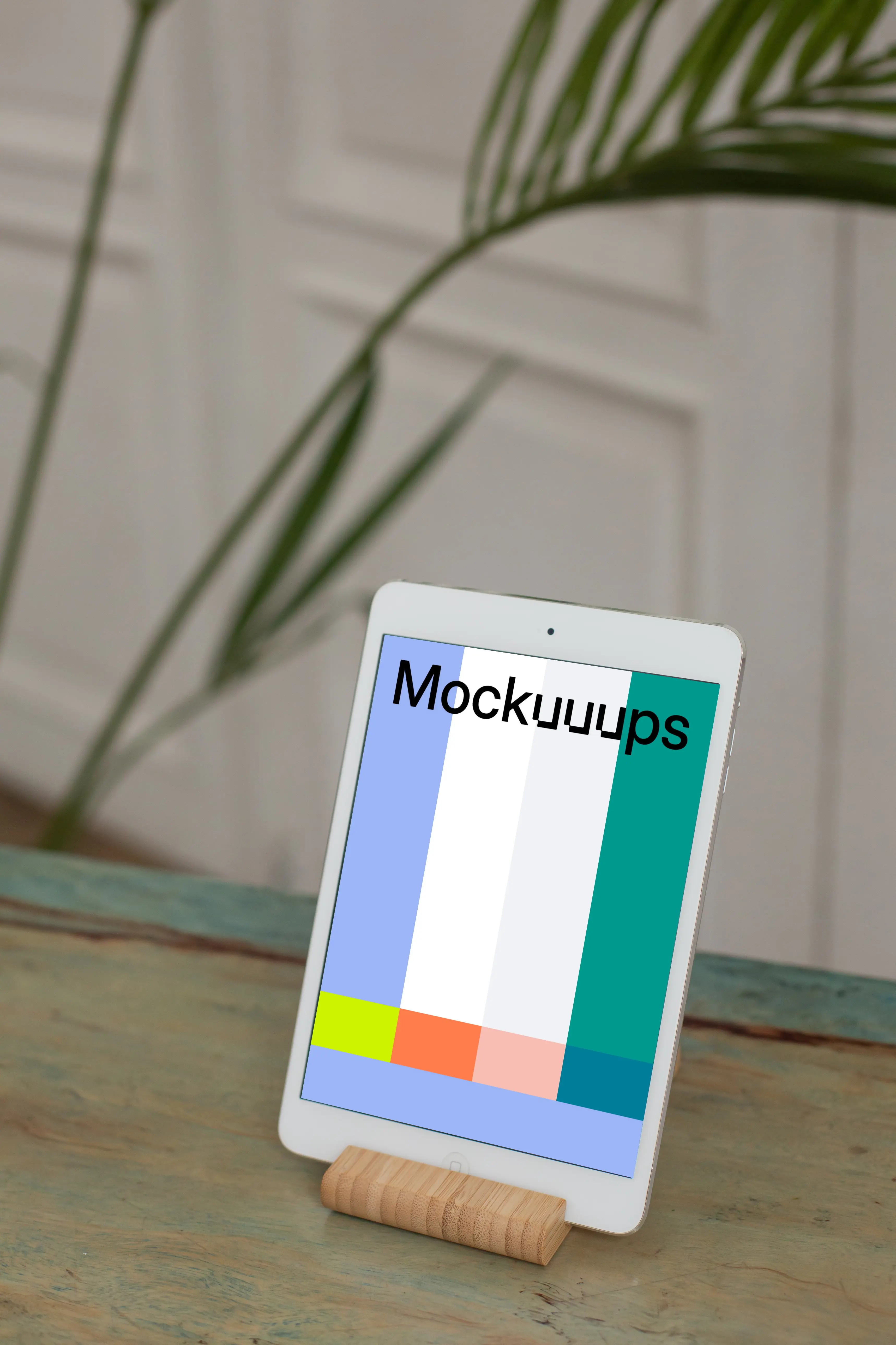 iPad Mini mockup on wooden stand and placed on a table