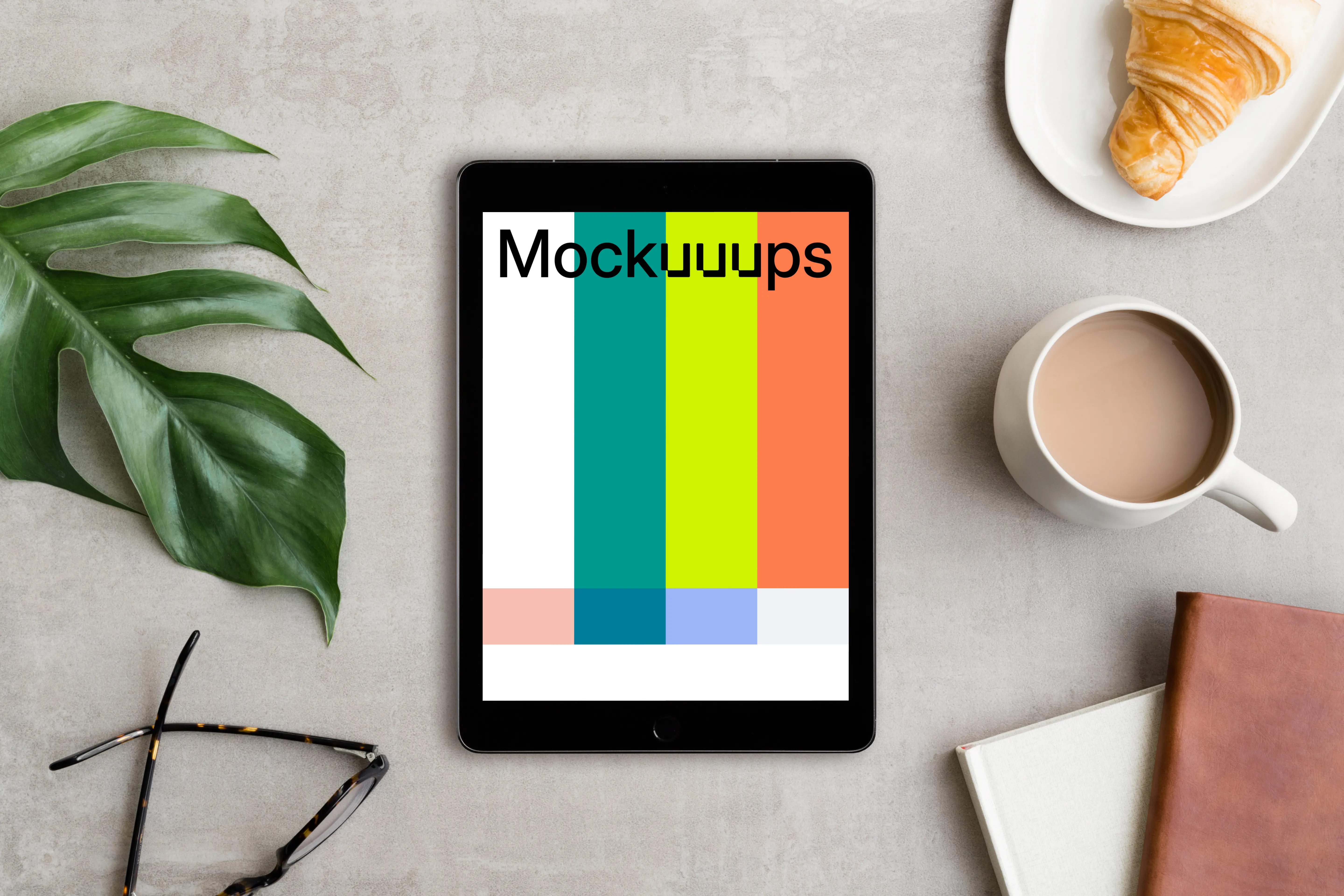 iPad Pro mockup next to the coffee and croissant