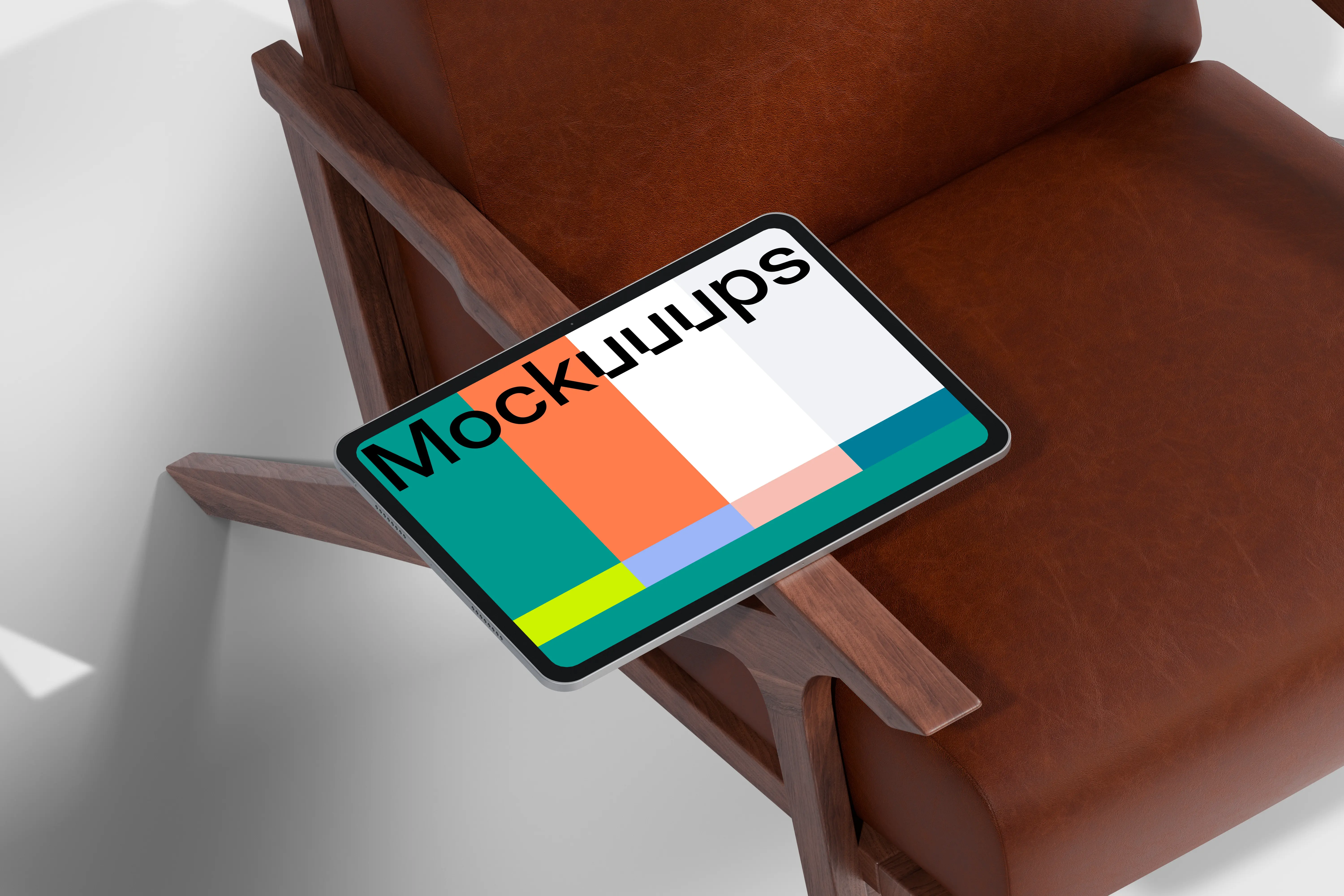 iPad Pro mockup on a modern leather chair