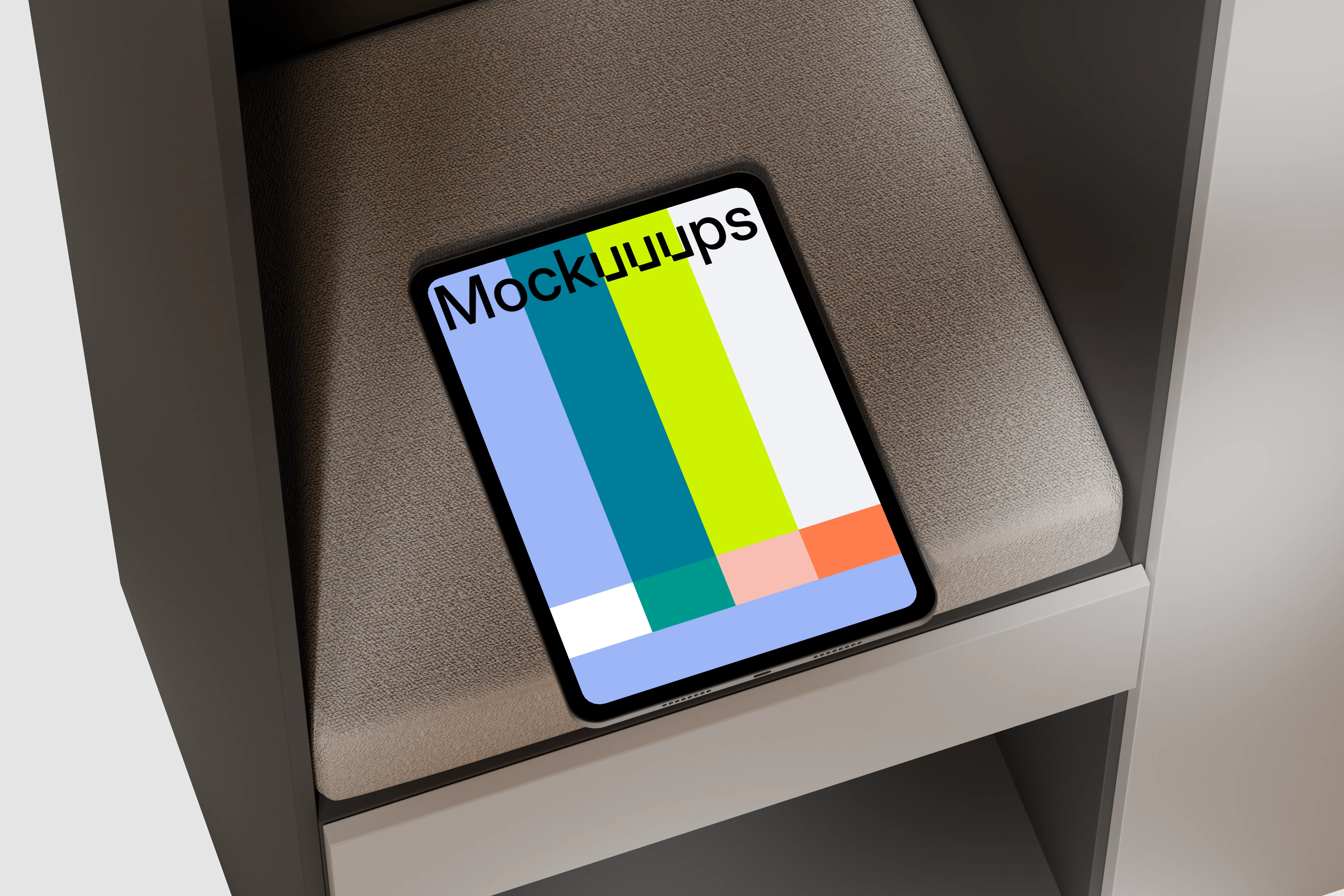 iPad Pro mockup on a textured cushion in a modern shelf