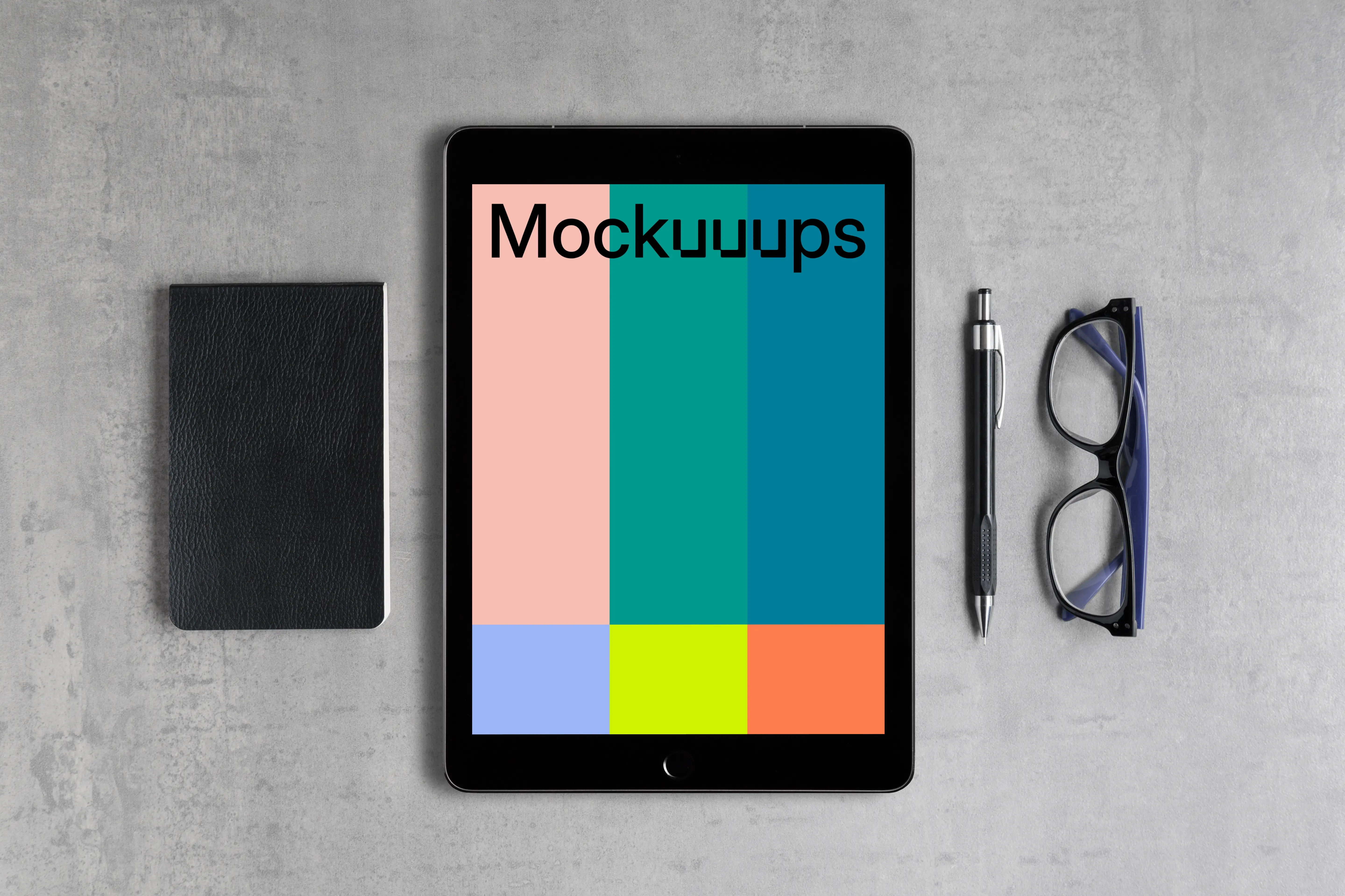 iPad Pro mockup with a journal on the side