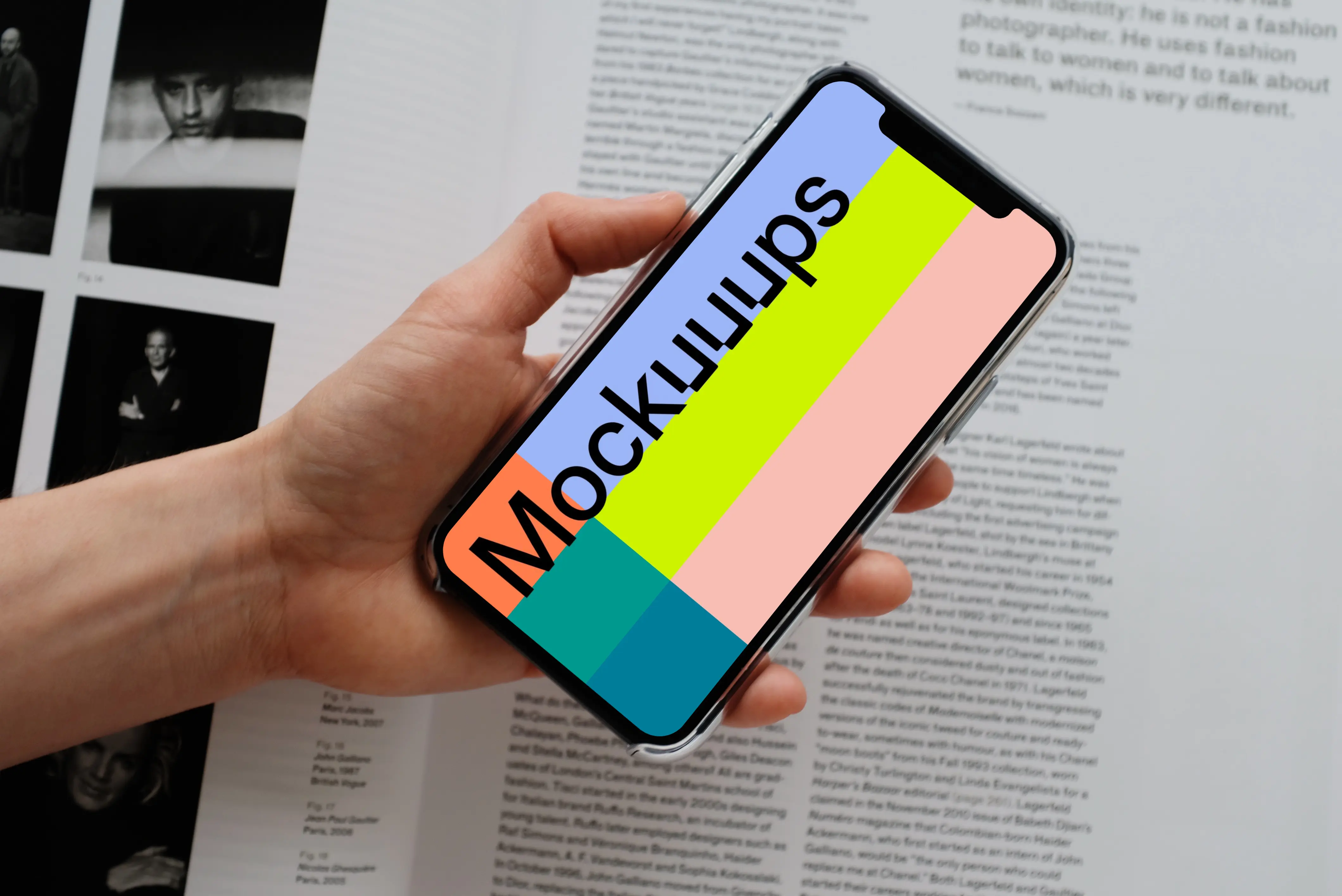 iPhone 12 Pro mockup held by user over an open magazine