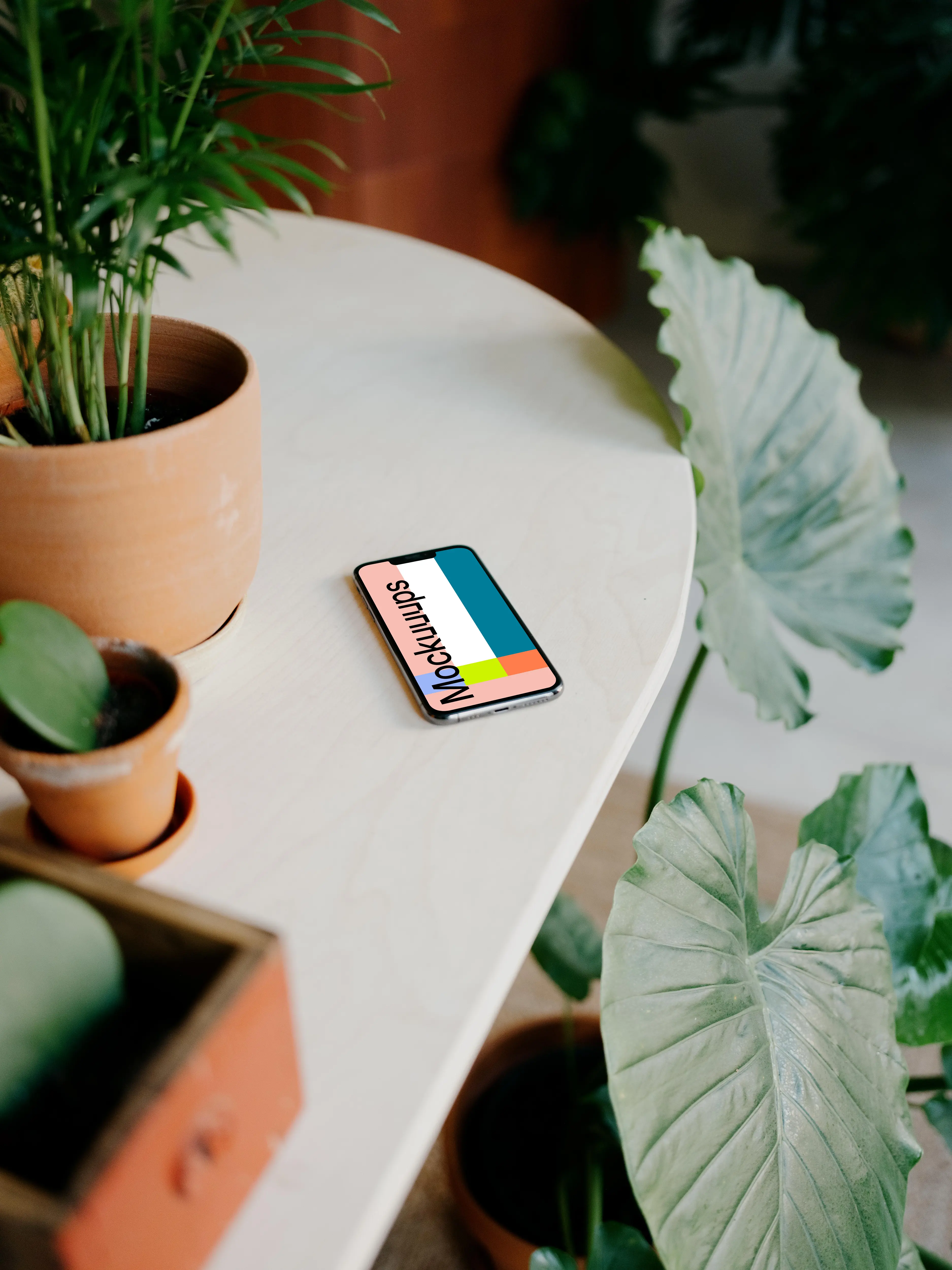 iPhone 13 Pro mockup on a white table 