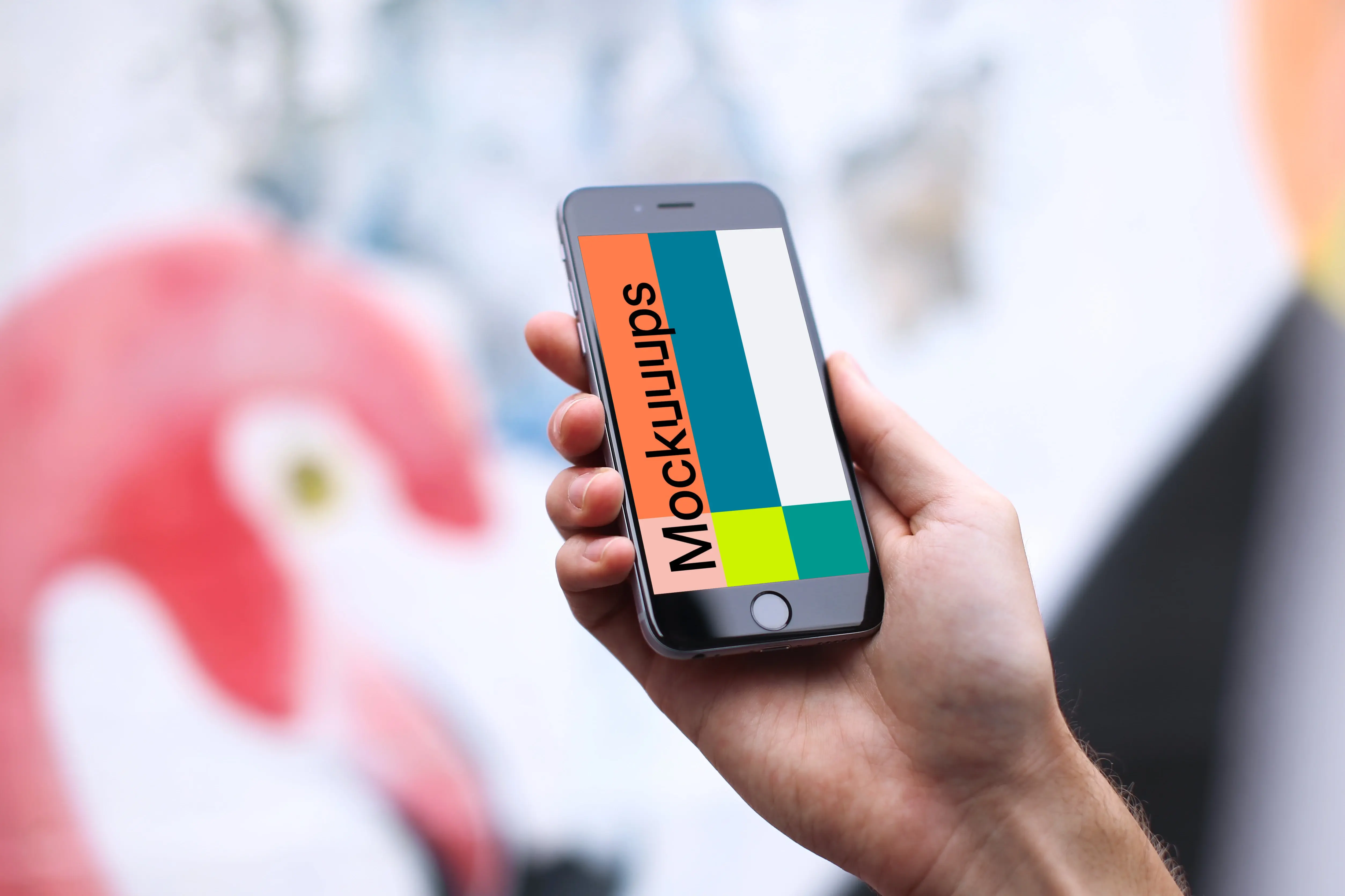 iPhone 6s mockup in front of the graffiti wall